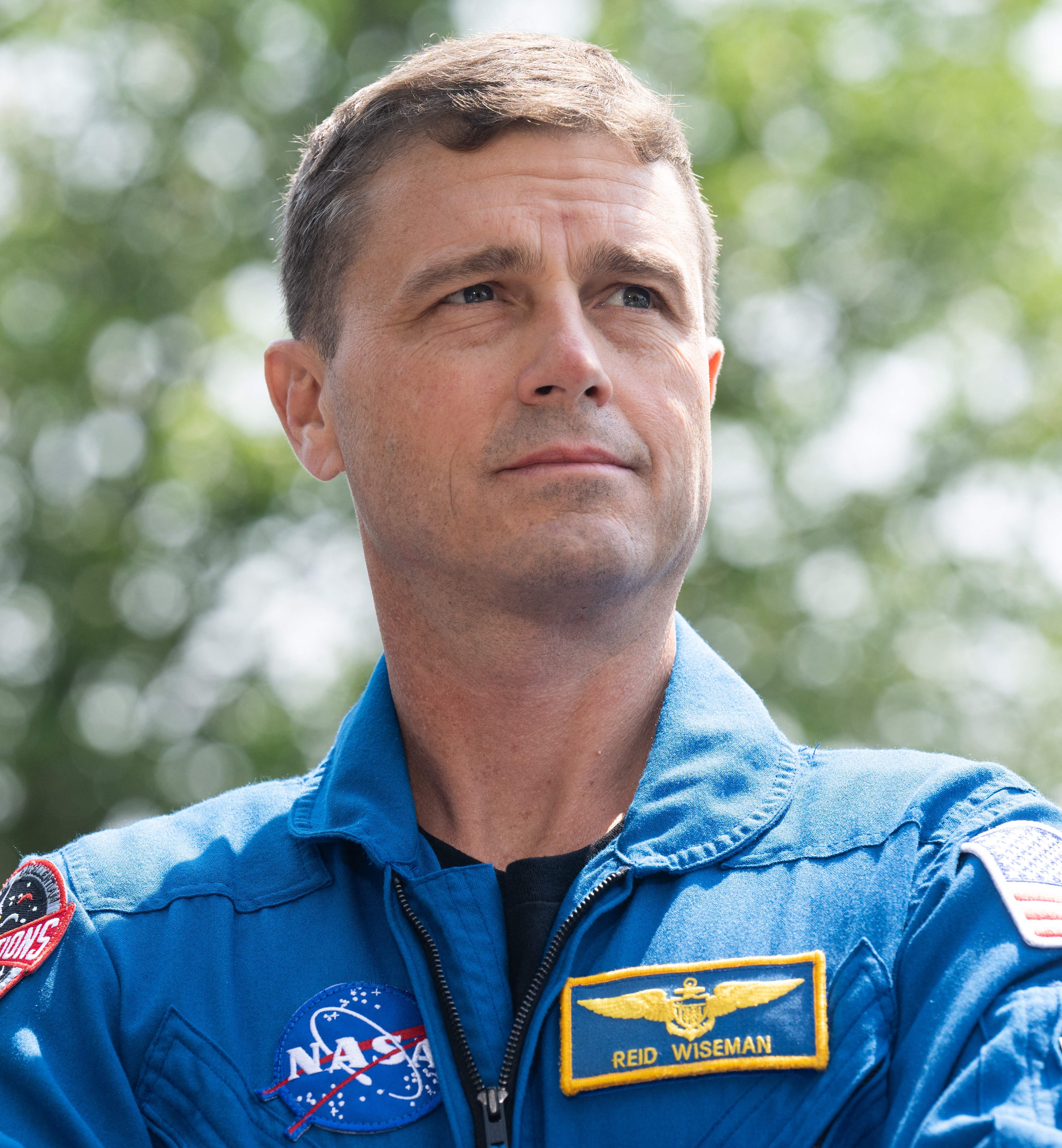 NASA astronaut Reid Wiseman, commander of the Artemis II mission around the moon, stands during a press conference outside the US Capitol in Washington, DC, May 18, 2023 | Source: Getty Images