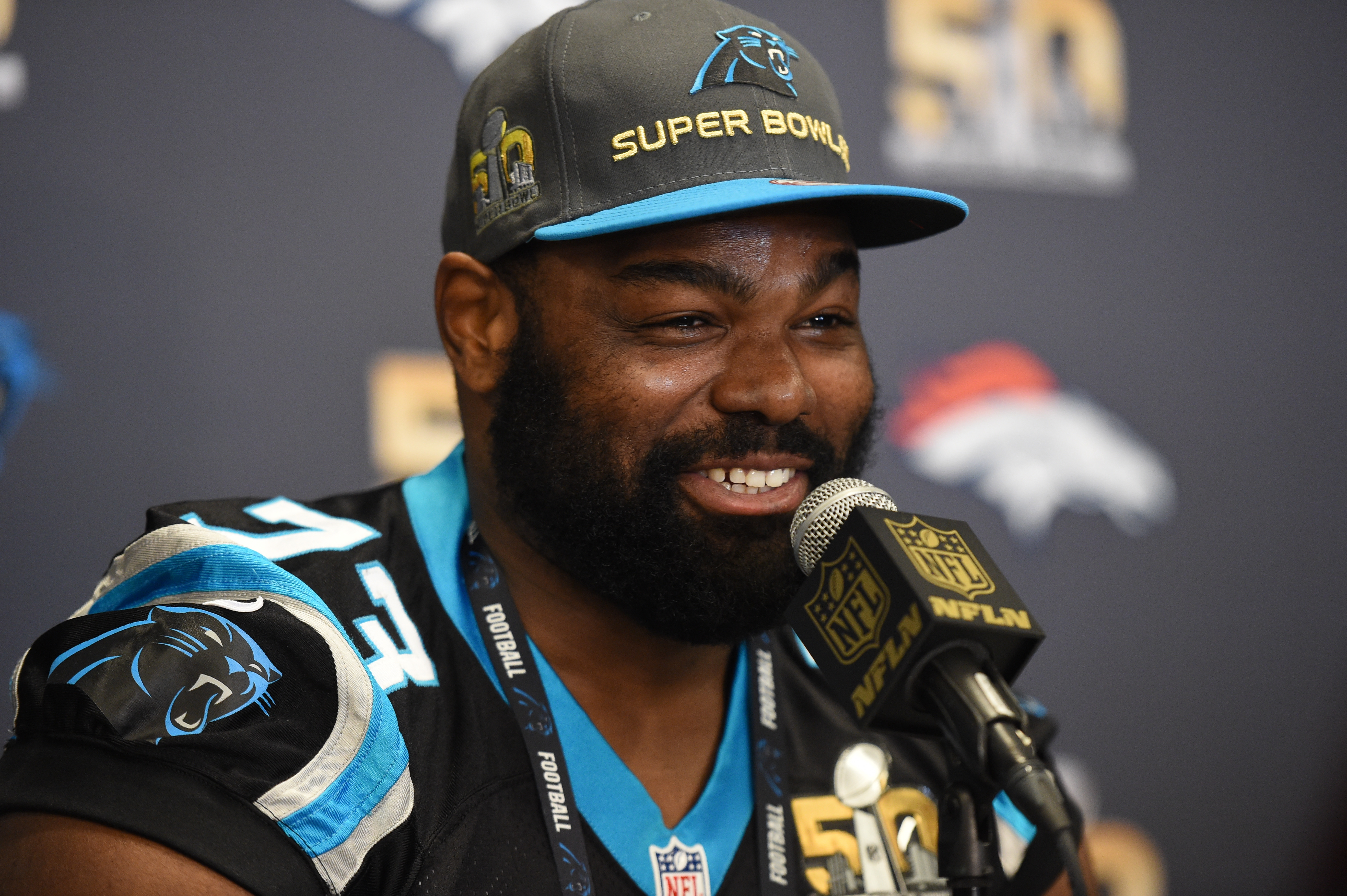 Michael Oher talks during the Carolina Panthers press conference for Super Bowl 50 in 2016 in San Jose, California. | Source: Getty Images