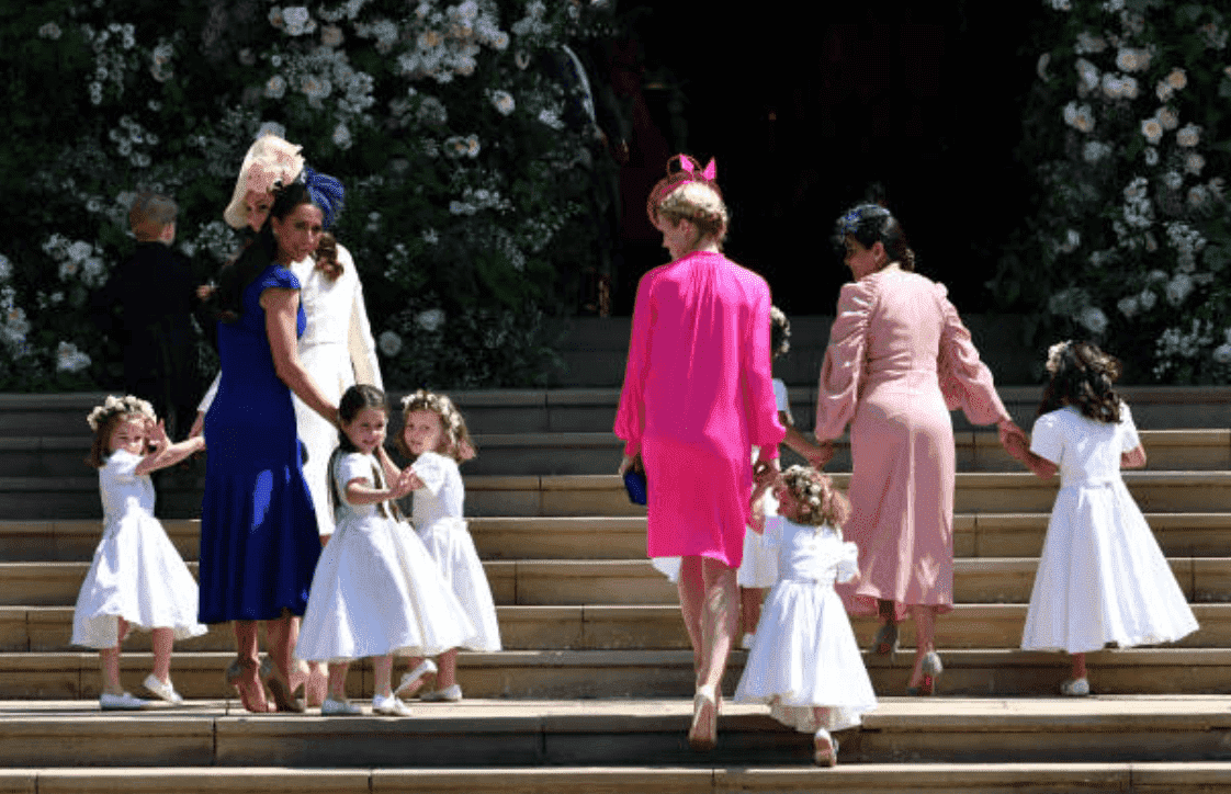 Princess Charlotte, Kate Middleton, Jessica Mulroney, Ivy Mulroney, Florence van Cutsem, Zoe Warren, Zalie Warren, Benita Litt, Remy Litt and Rylan Litt walk up the church steps as they arrive for Prince Harry and Meghan Markle's wedding at St George's Chapel, on May 19, 2018, in Windsor, England | Source: Ben Stansall - WPA Pool/Getty Images