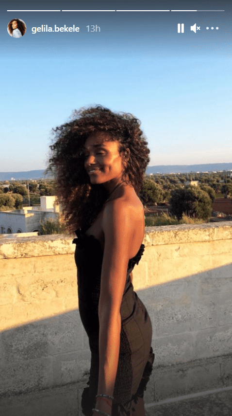 Gelila Bekele in a photo flaunting her hair and dimple in a black dress. | Photo: Instagram/gelila.bekele
