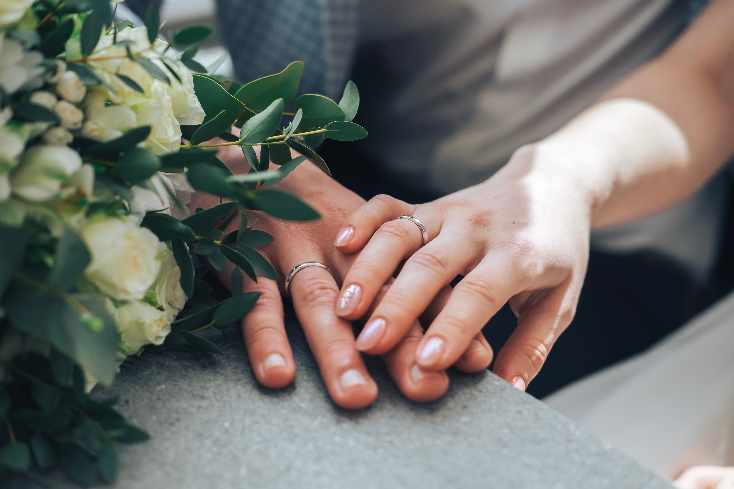 Man and woman folded their hands | Shutterstock