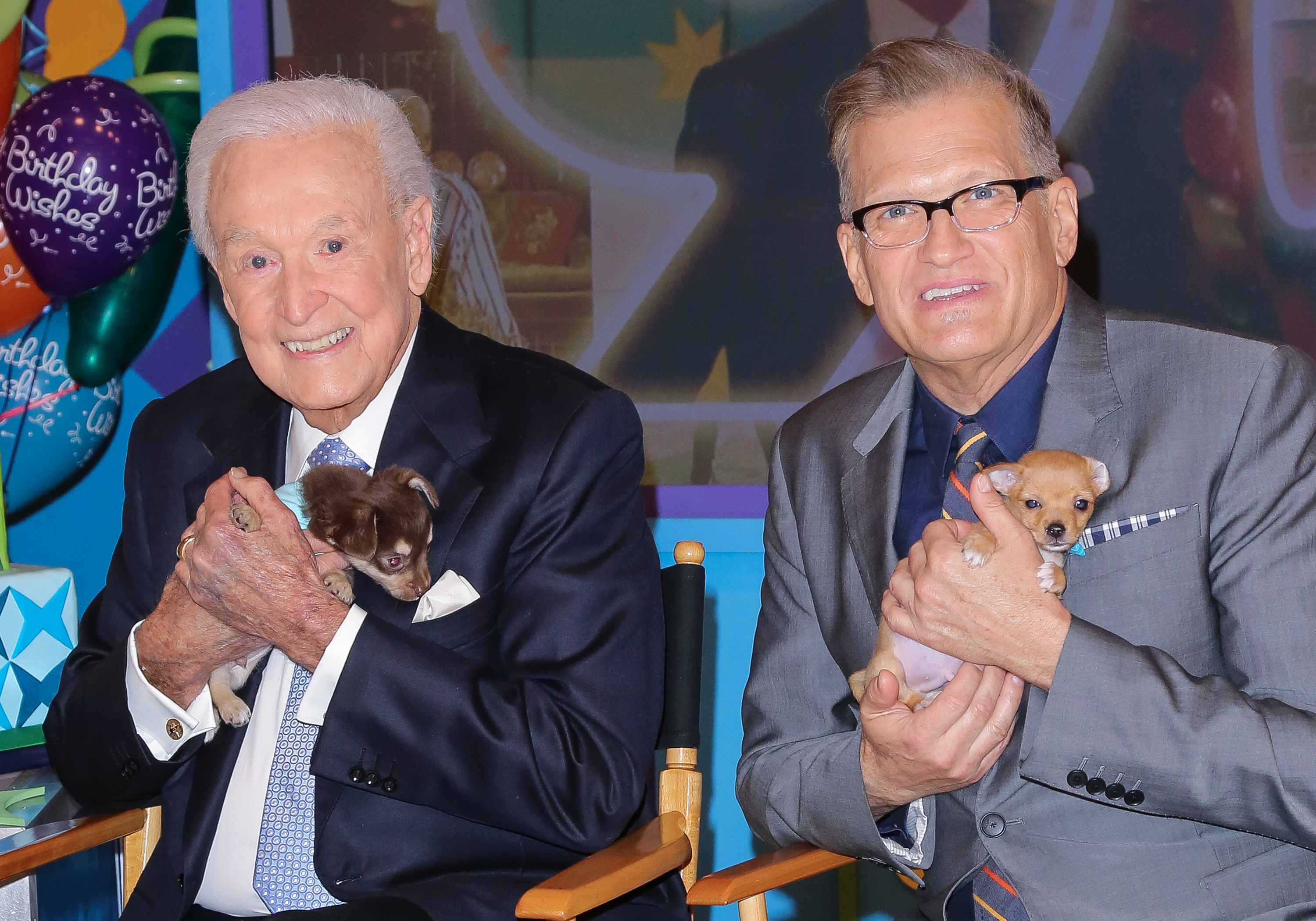 Bob Barker and Drew Carey on the set of "The Price Is Right" to celebrate Barker's 90th birthday at CBS Television City on November 5, 2013, in Los Angeles, California | Source: Getty Images