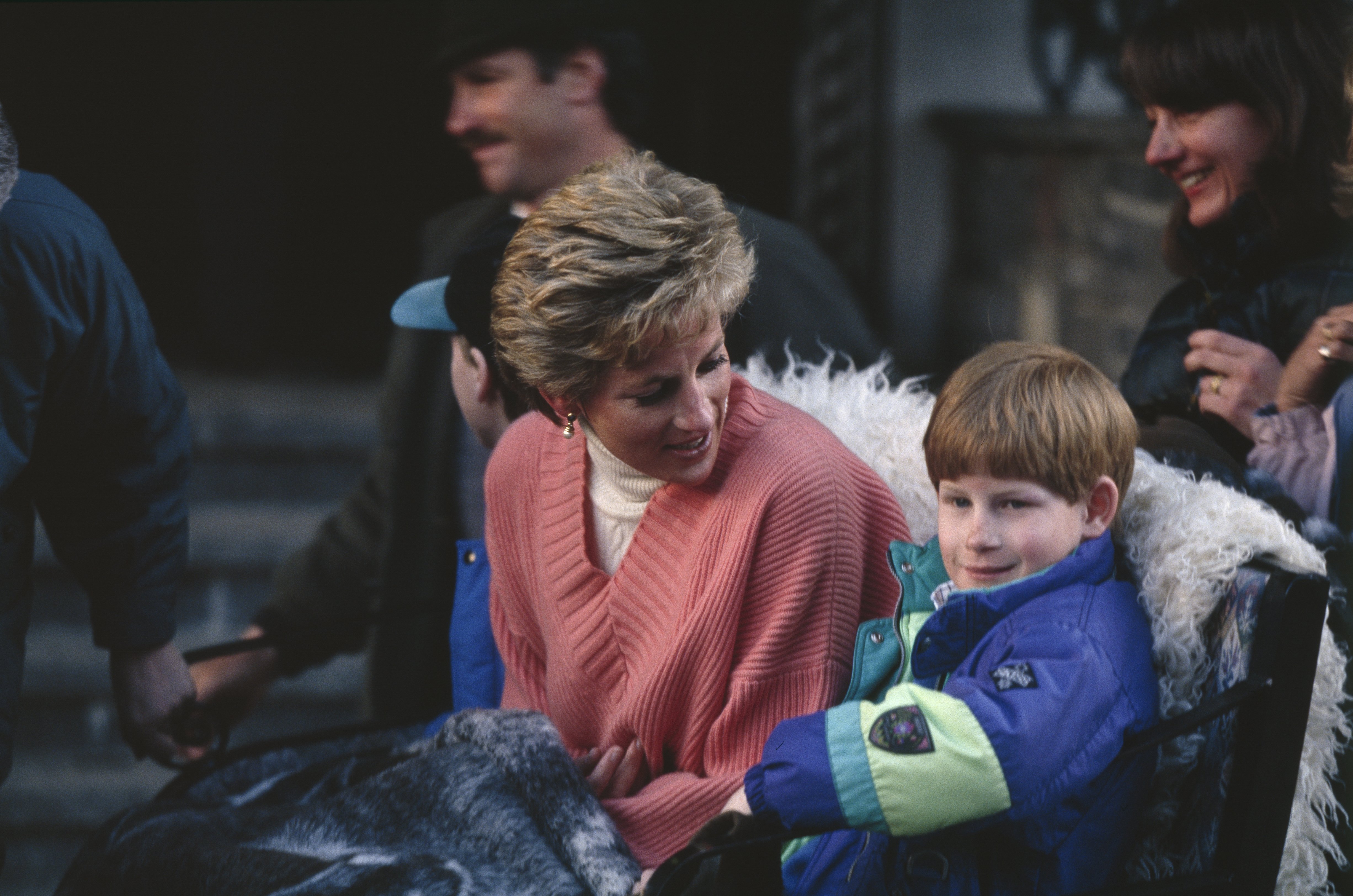 Princess Diana and her sons Prince Harry and Prince William (in cap behind his mother) during a holiday in the Austrian resort of Lech on March 24, 1994. / Source: Getty Images