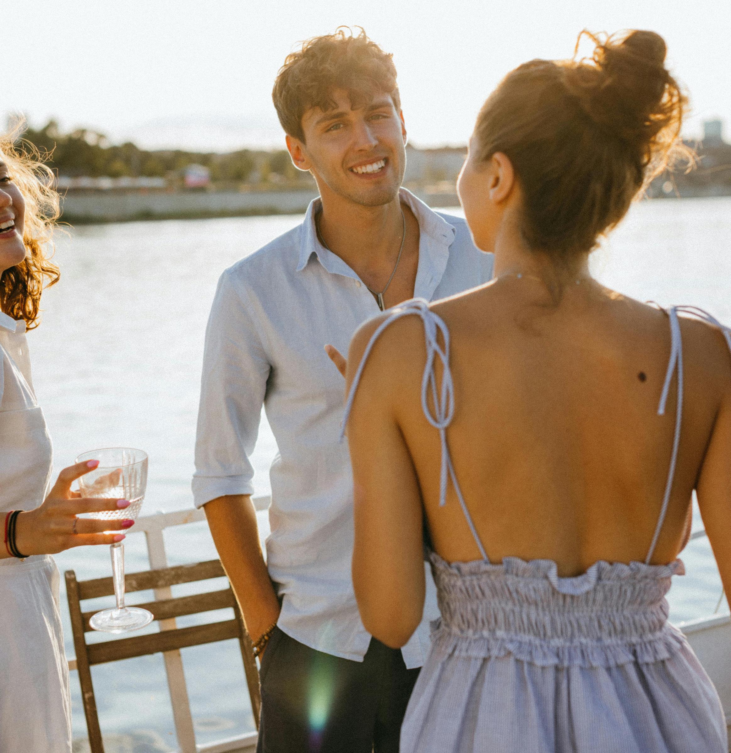 A young man and woman having a conversation onboard a boat | Source: Pexels