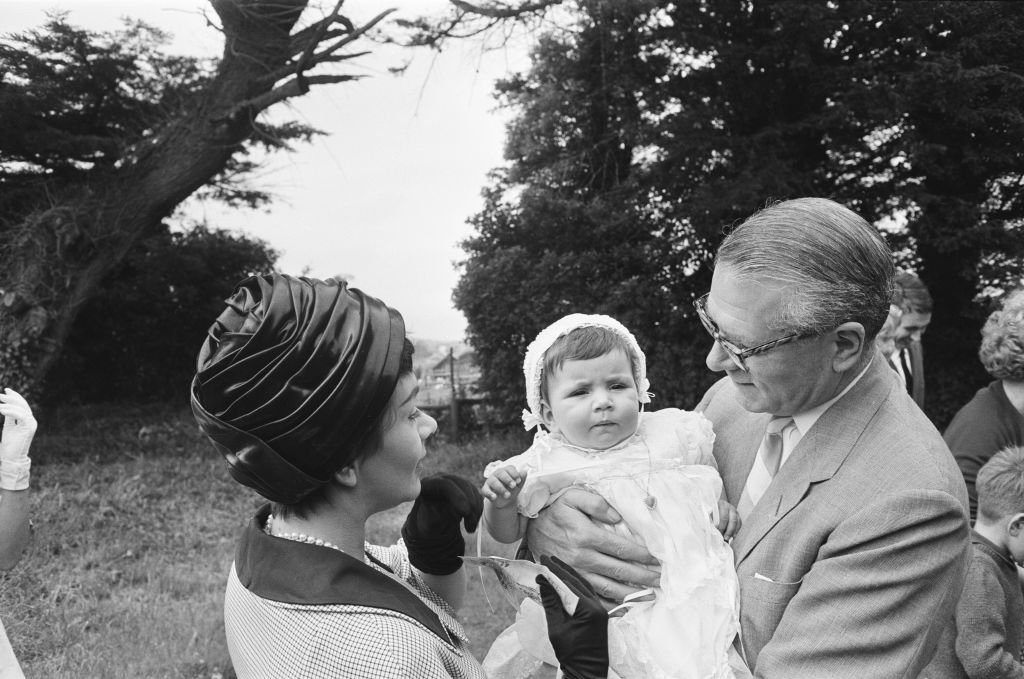 Laurence Olivier and Joan Plowright attend the Christening of their daughter Tamsin on July 14, 1963 | Photo: Getty Images