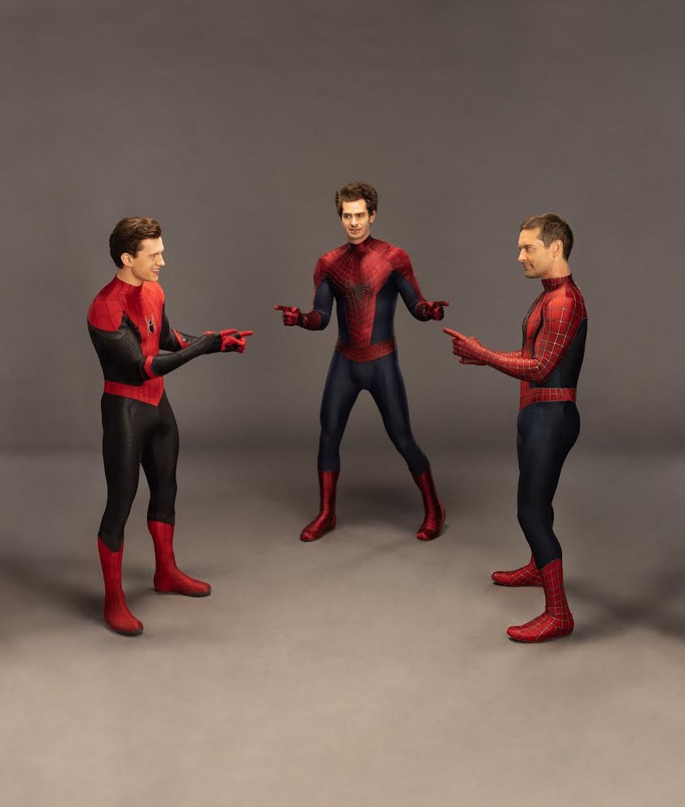 Tom Holland, Andrew Garfield, and Tobey Maguire pointing at each other, dated February 2022 | Source: Instagram/tomholland2013
