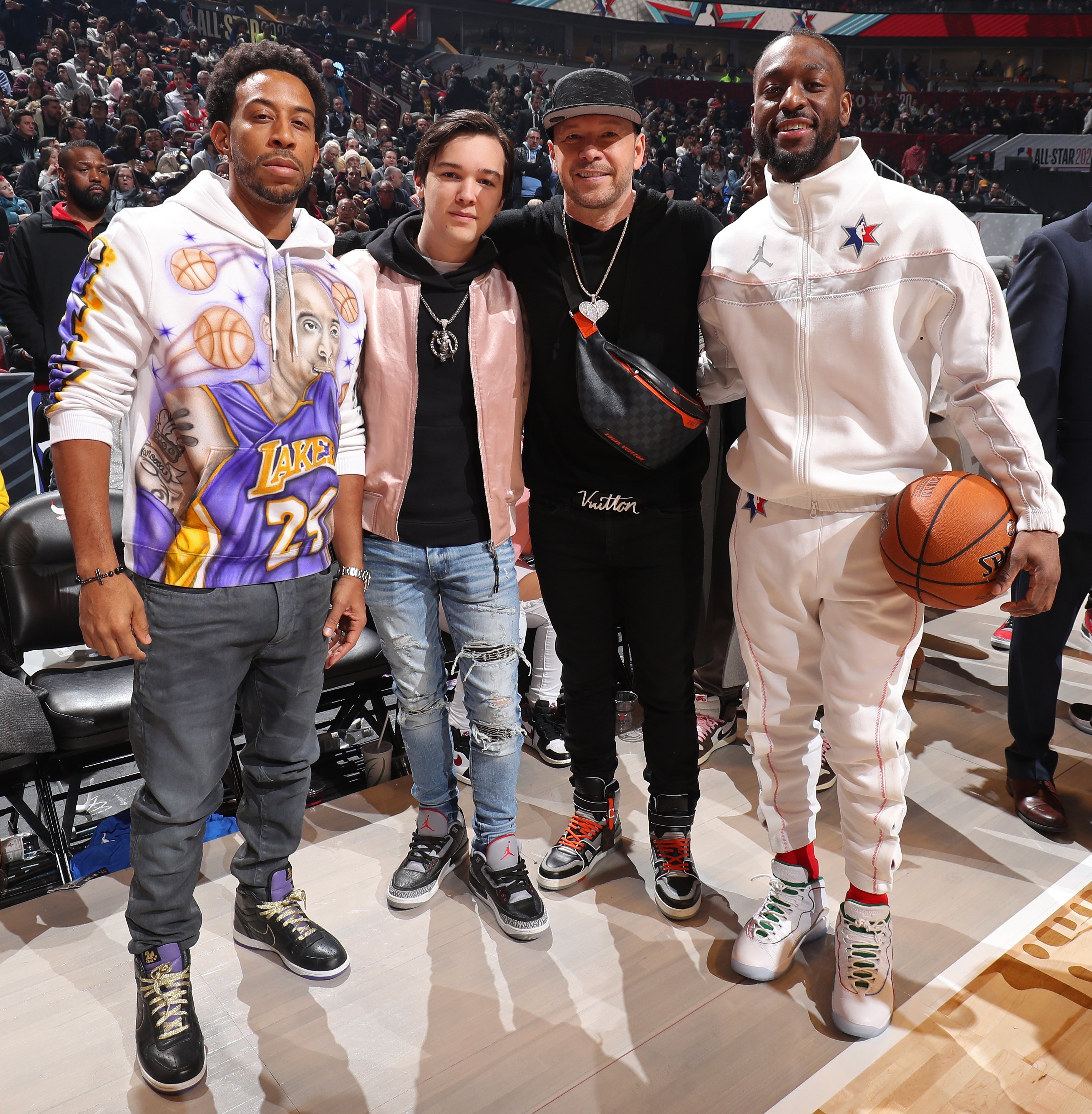 Ludacris, Elijah Wahlberg, Donnie Wahlberg, and Kemba Walker pose for a photo during the 69th NBA All-Star Game at the United Center on February 16, 2020, in Chicago, Illinois. | Source: Getty Images