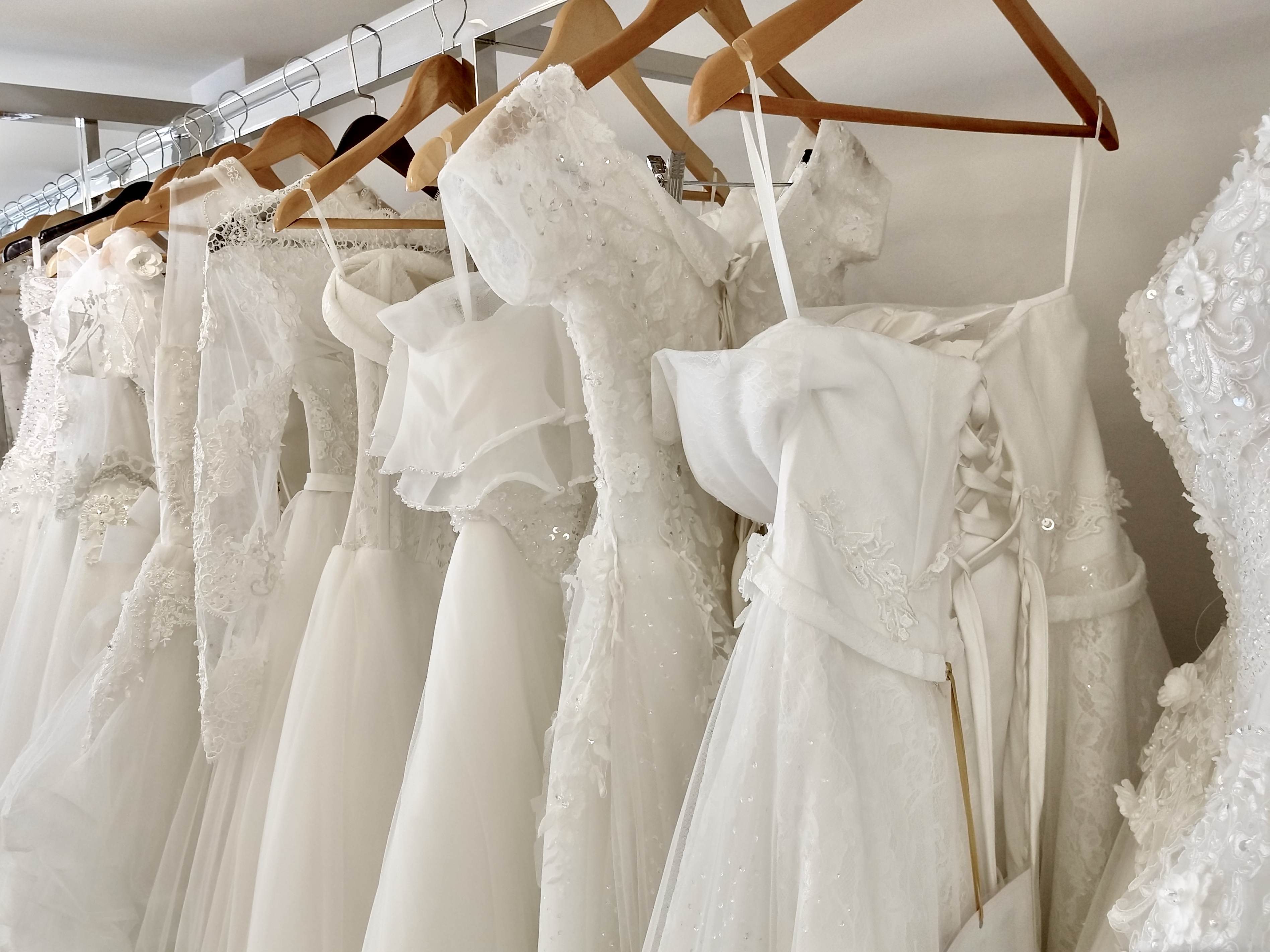 Wedding dresses on rack | Source: Getty Images