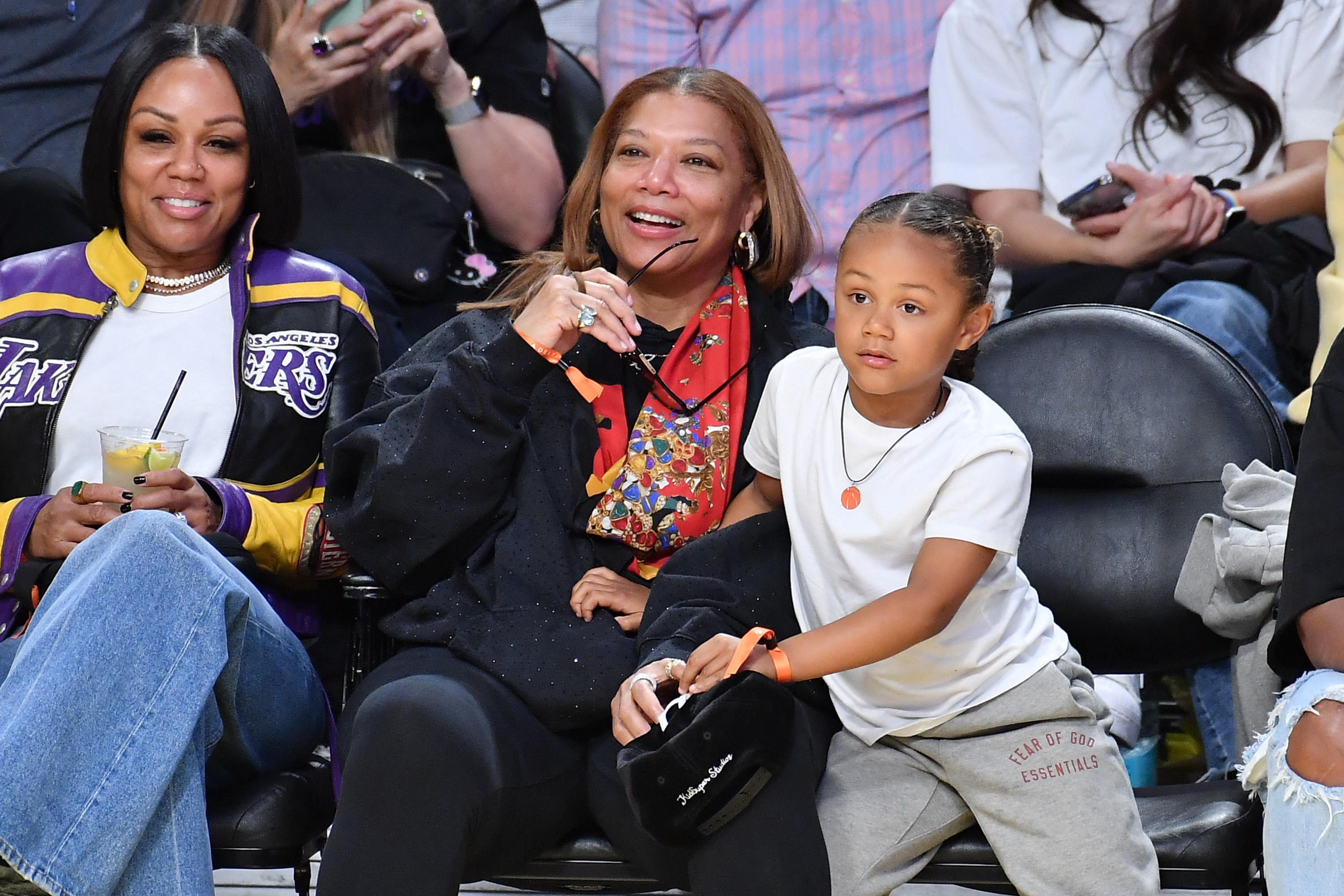 Eboni Nicols, Queen Latifah, and their son Rebel at a game between the Los Angeles Lakers and the Denver Nuggets in Los Angeles, California on March 19, 2025. | Source: Getty Images