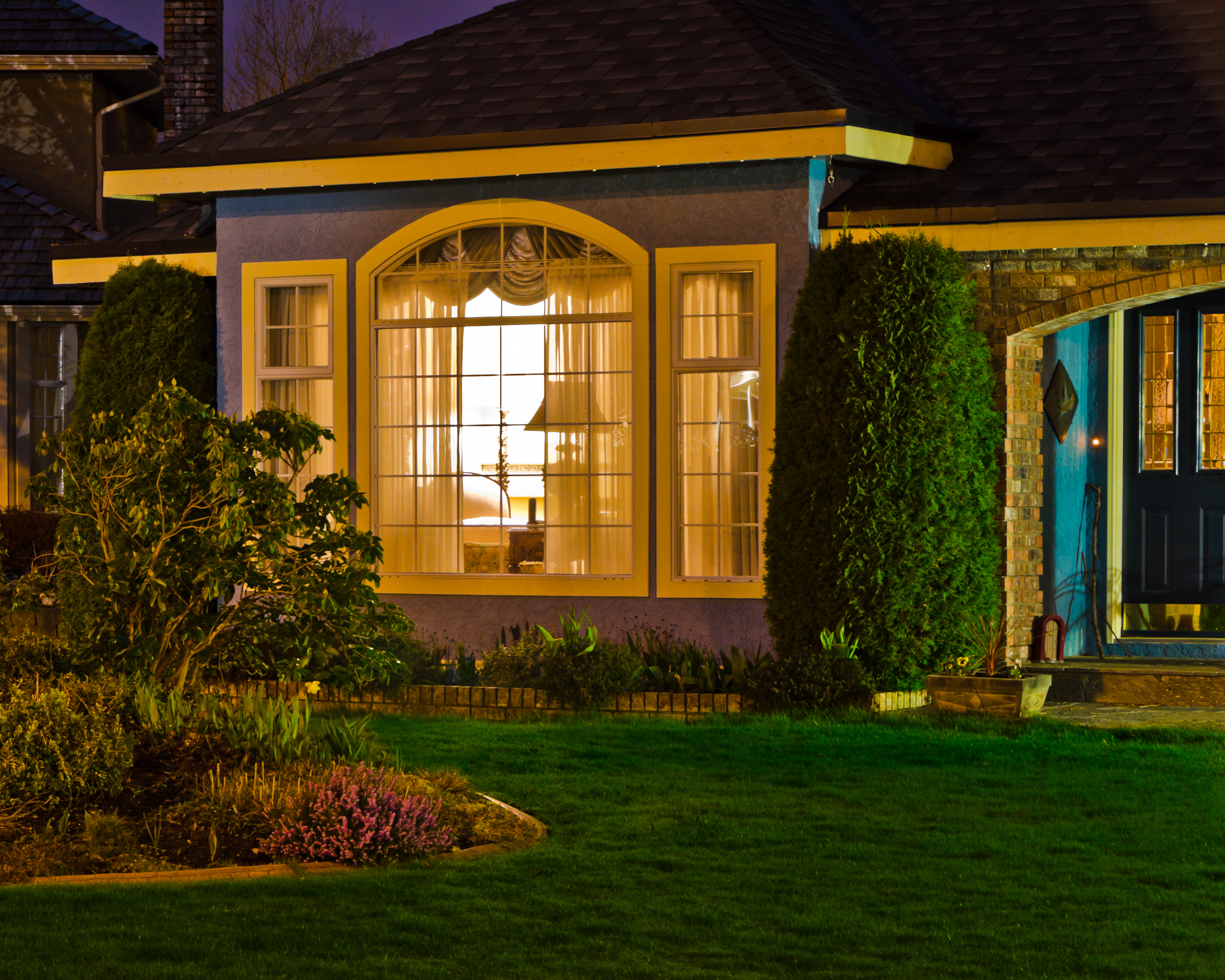 Entrance of a house at night. | Source: Shutterstock