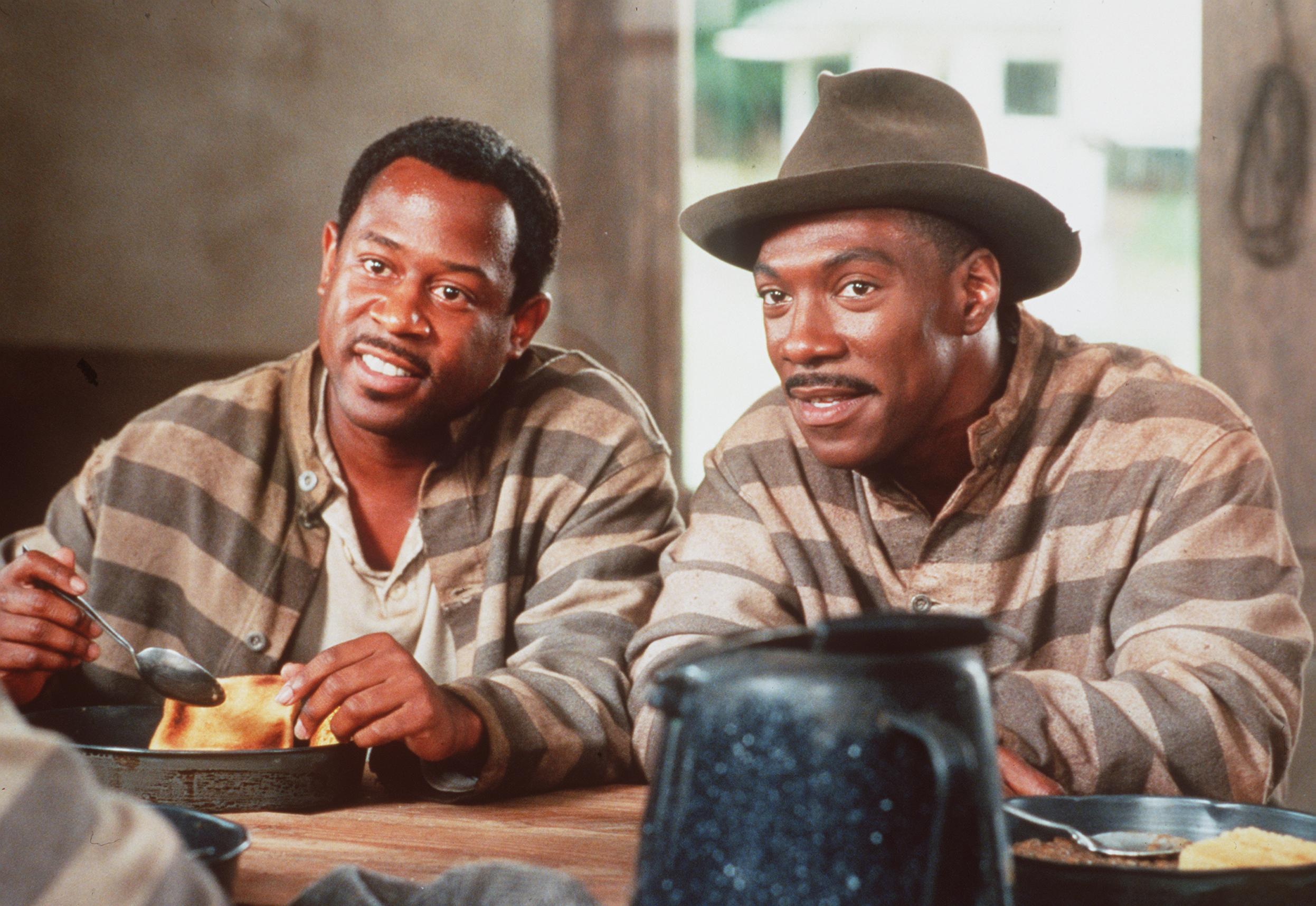 Martin Lawrence and Eddie Murphy acting in "Life" on May 18, 1999. | Source: Getty Images