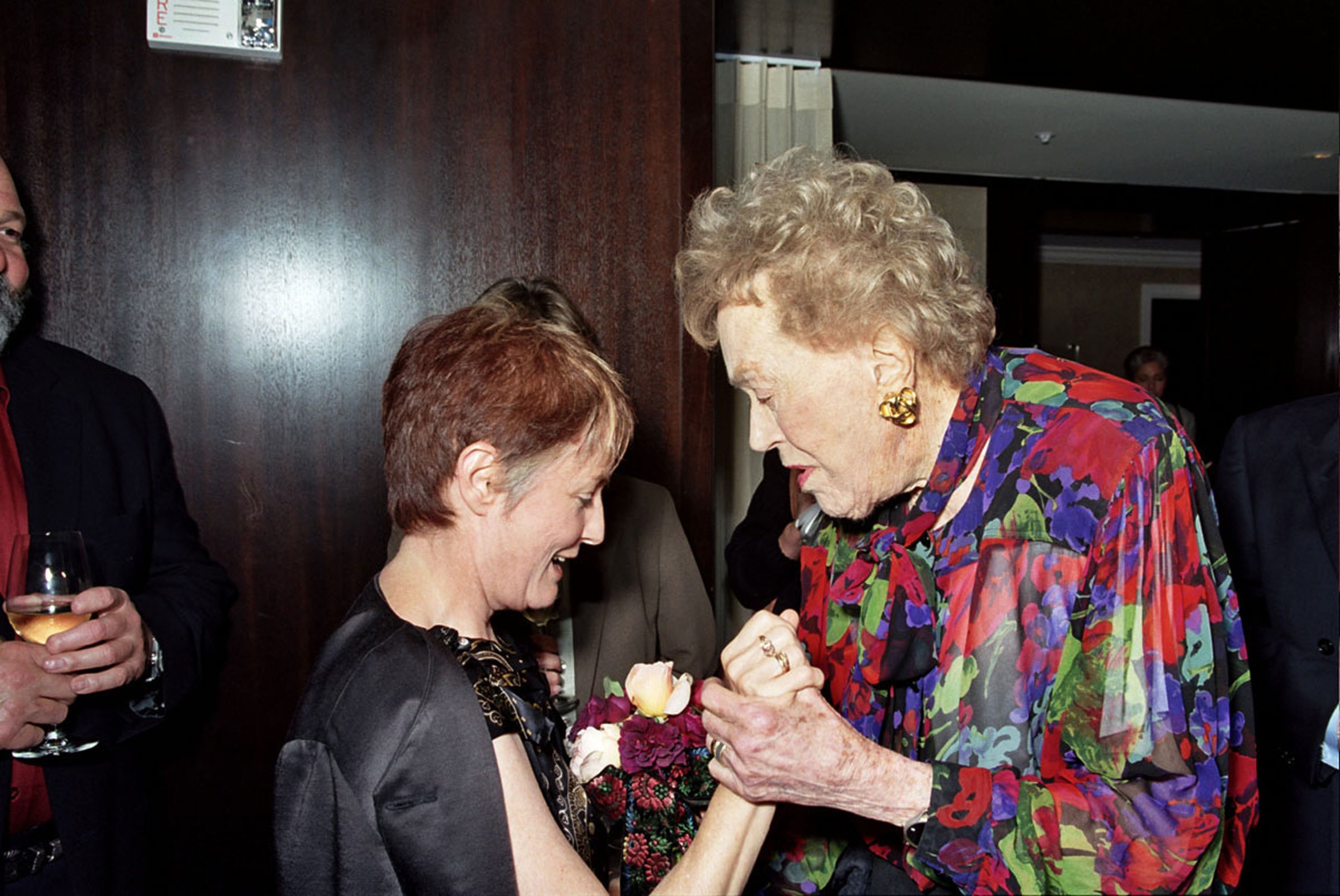 Alice Waters of Chez Panisse gives chef Julia Child a bouquet of roses from her garden during a charity pre-birthday dinner at the Fifth Floor restaurant on August 1, 2002 in San Francisco, California. Photo: Getty Images