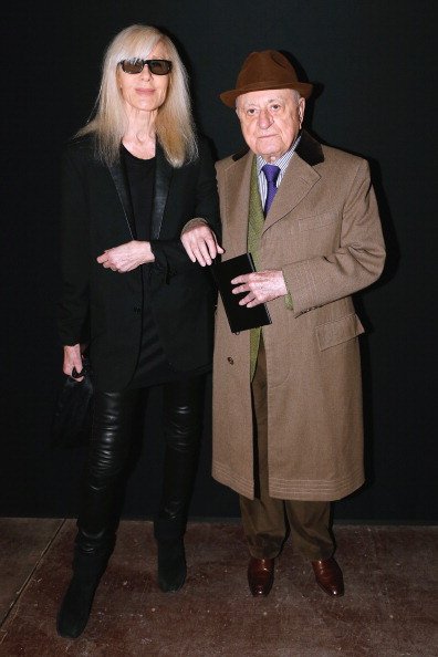 Betty Catroux et Pierre Berge participent au défilé Saint Laurent Automne / Hiver 2014-2015 dans le cadre de la Fashion Week de Paris le 19 janvier 2014 à Paris, France. | Photo : Getty Images Betty Catroux et Pierre Berge participent au défilé Saint Laurent Automne / Hiver 2014-2015 dans le cadre de la Fashion Week de Paris le 19 janvier 2014 à Paris, France. | Photo : Getty Images