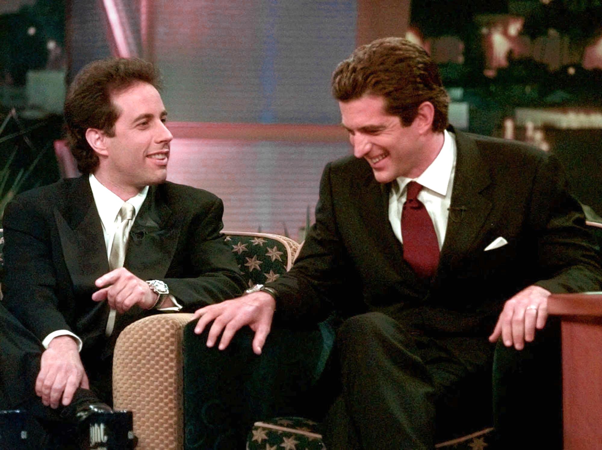 Television star Jerry Seinfeld (L) in a conversation with John F. Kennedy Jr. during the taping of "The Tonight Show With Jay Leno" in Burbank, California on May 14 1998 | Source: Getty Images