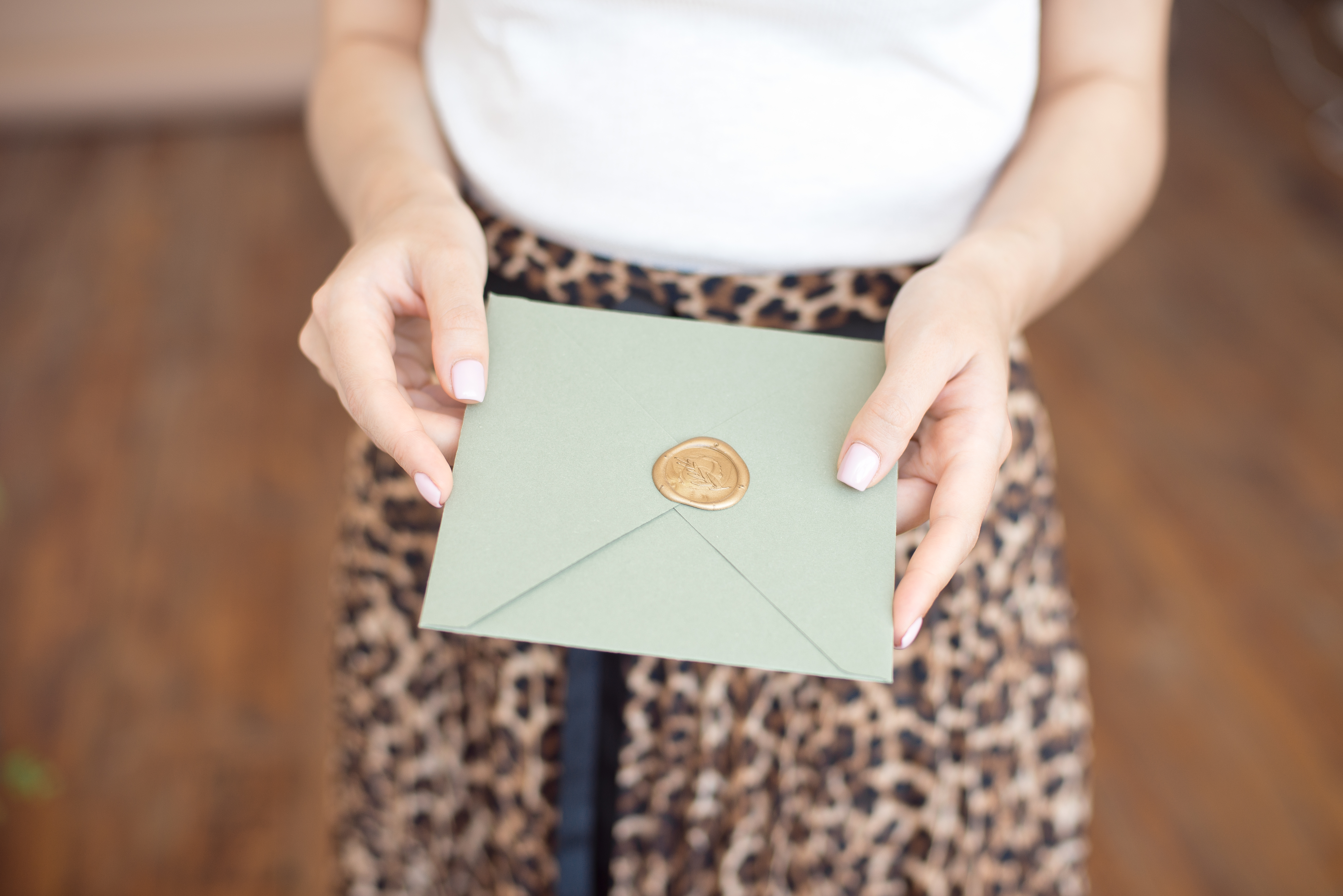 A woman holding a sealed envelope | Source: Shutterstock