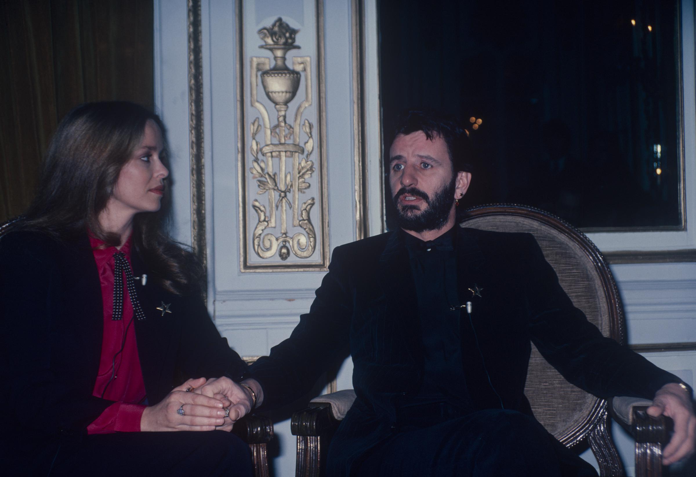 Barbara Bach and Ringo Starr miked for an interview, in New York, circa 1970. | Source: Getty Images