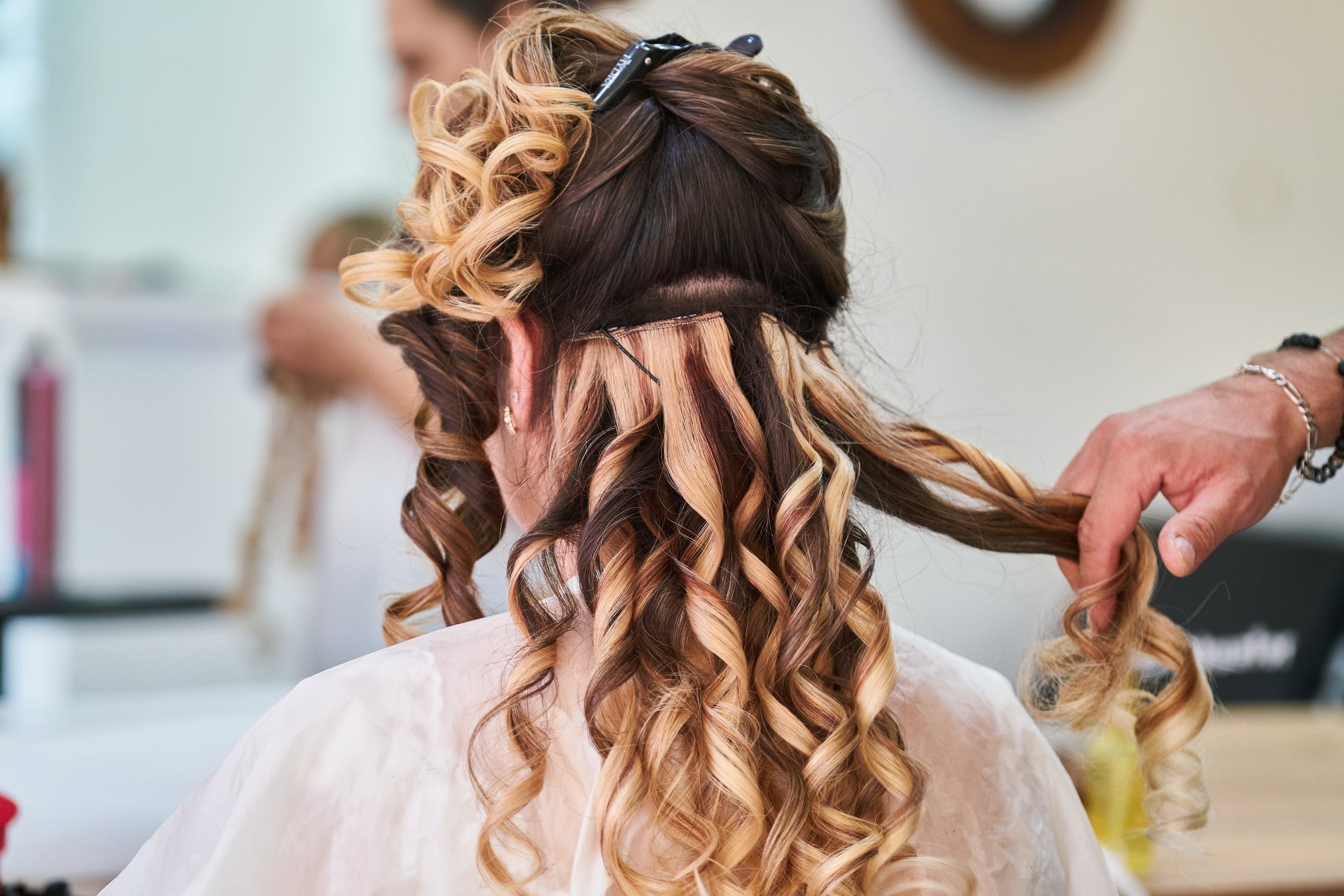 Styling a model's hair | Source: Pexels