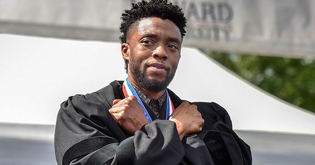 Chadwick Boseman doing a 'Wakanda Forever' salute to the crowd as Howard University during its commencement ceremonies in Washington, DC. | Photo: Bill O'Leary/The Washington Post via Getty Images