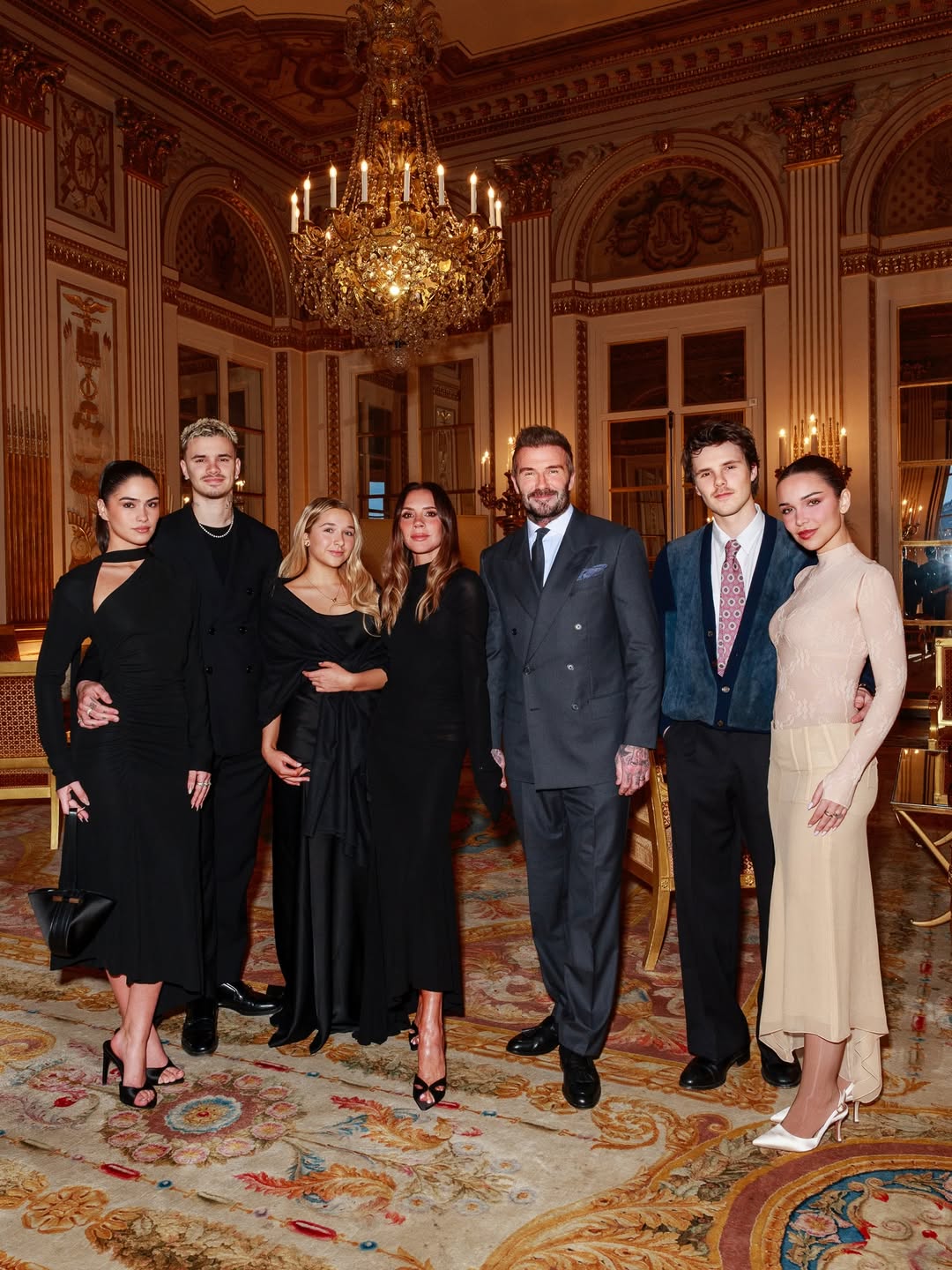 Kim Turnbull, Romeo Beckham, Harper Beckham, Victoria Beckham, David Beckham, Cruz Beckham, and Jackie Apostel attend Victoria's medal ceremony at the Ministry of Culture on 26 January 2026 in Paris, Italy. | Source: Instagram/victoriabeckham