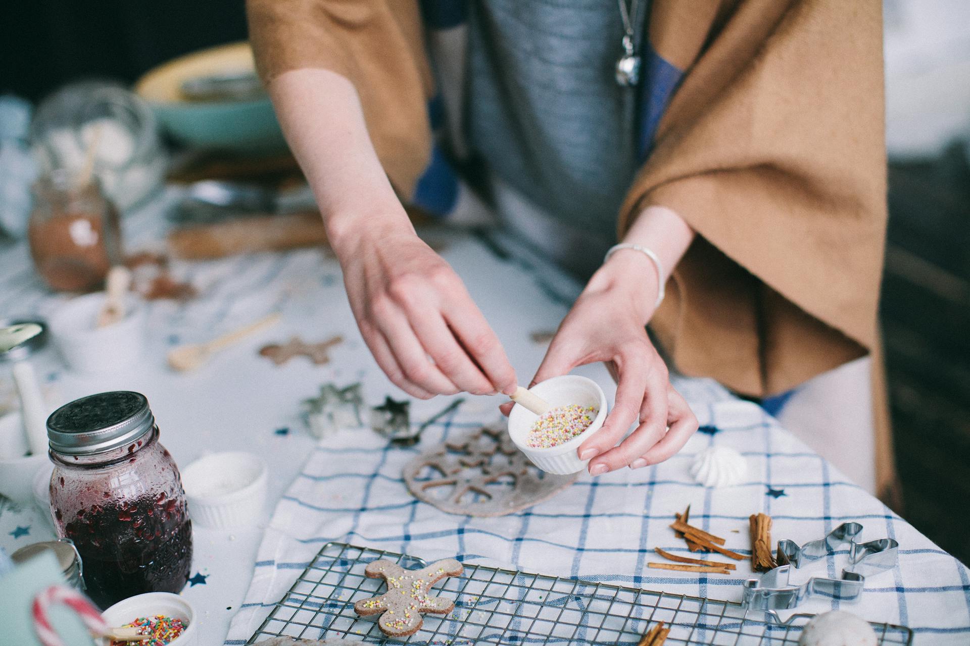 A person baking gingerbread cookies | Source: Pexels