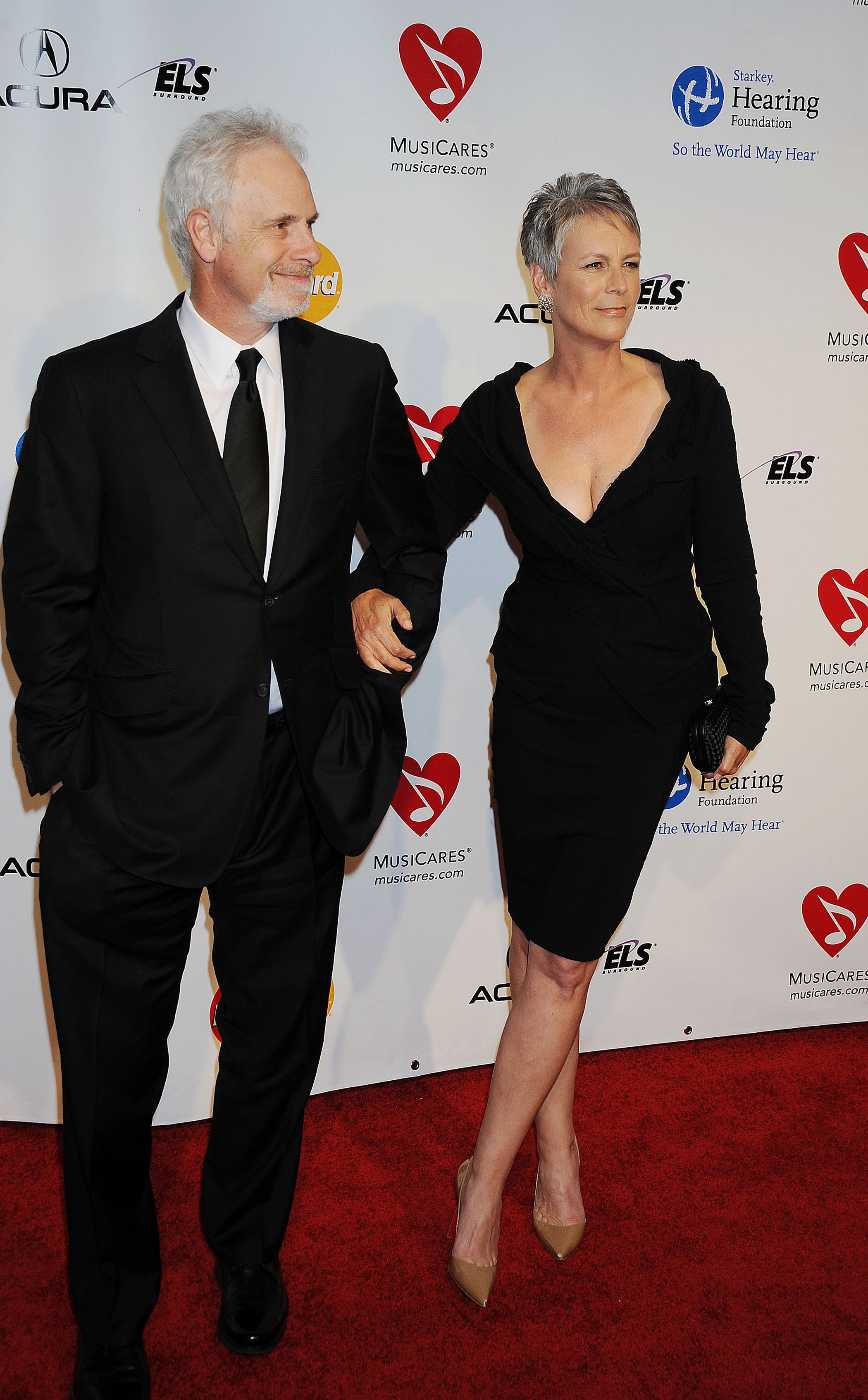 Christopher Guest and Jamie Lee Curtis arrive at the MusiCares Person Of the Year Honoring Barbra Streisand at Los Angeles Convention Center in Los Angeles, California on February 11, 2011. | Source: Getty Images