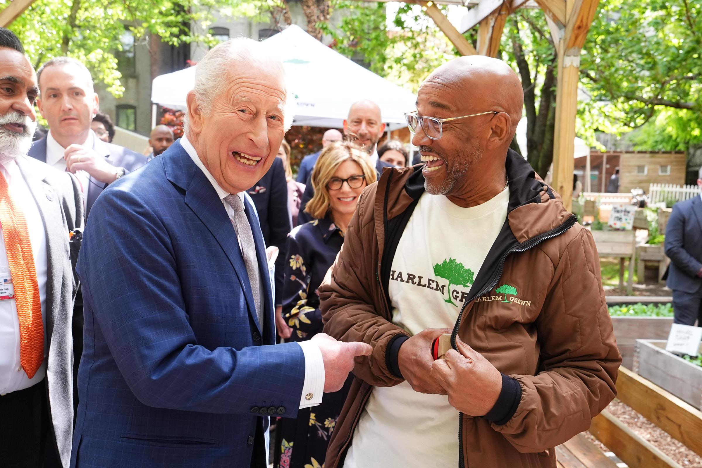 King Charles III shares a light moment with a local community member during a visit in New York City on April 29, 2026 | Source: Getty Images