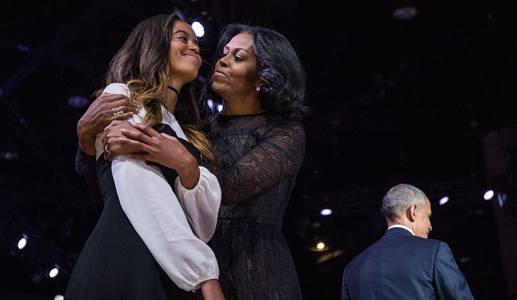 President Obama is joined by Michelle and Malia after his farewell address at McCormick Place in Chicago | Photo: Getty Images