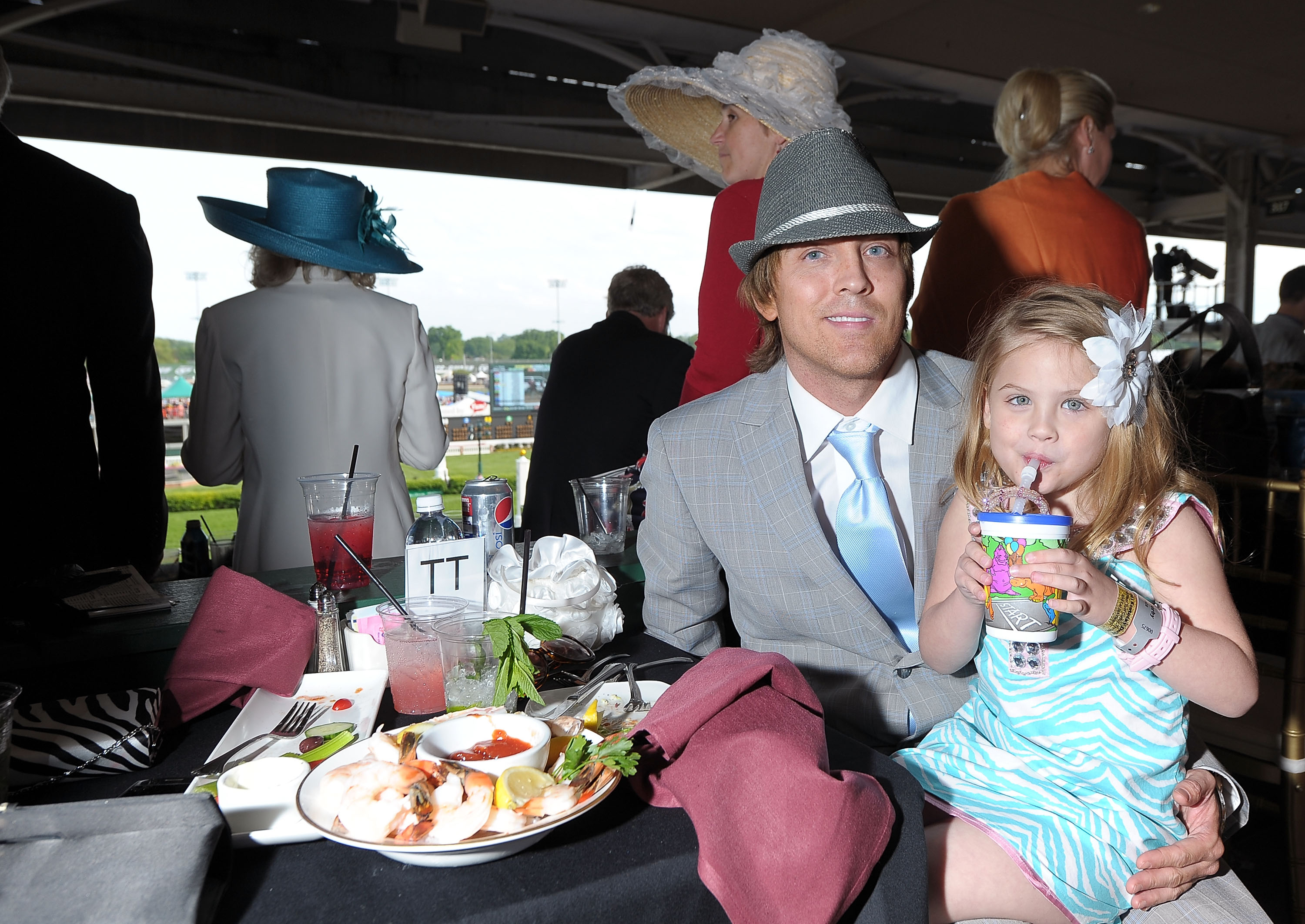 Larry Birkhead and Dannielynn Birkhead attend the Kentucky Derby at Churchill Downs on May 7, 2011, in Louisville, Kentucky.