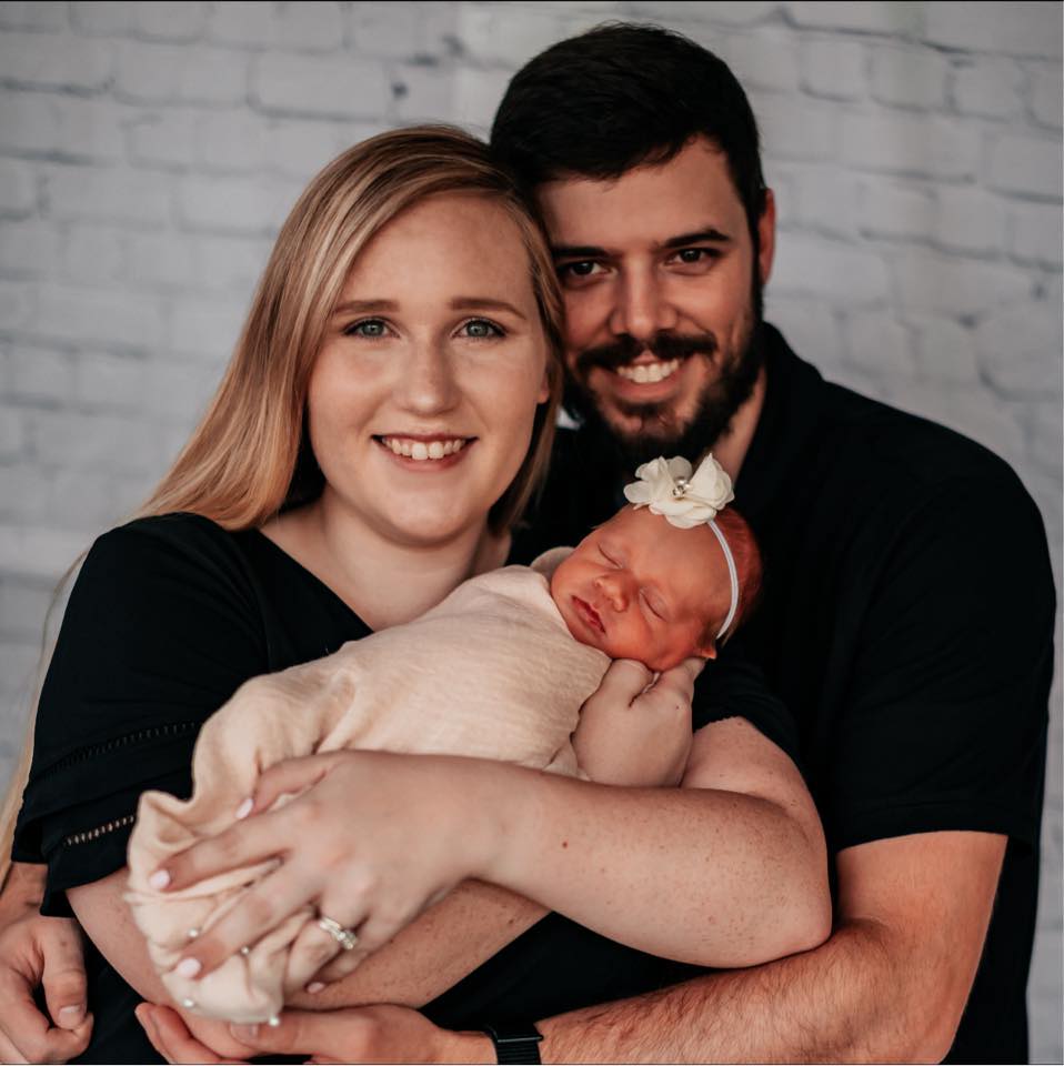 Ada Chapman Doss and her husband posing for a family portrait with one of their kids, posted on July 14, 2023. | Source: Facebook/Ada Chapman Doss