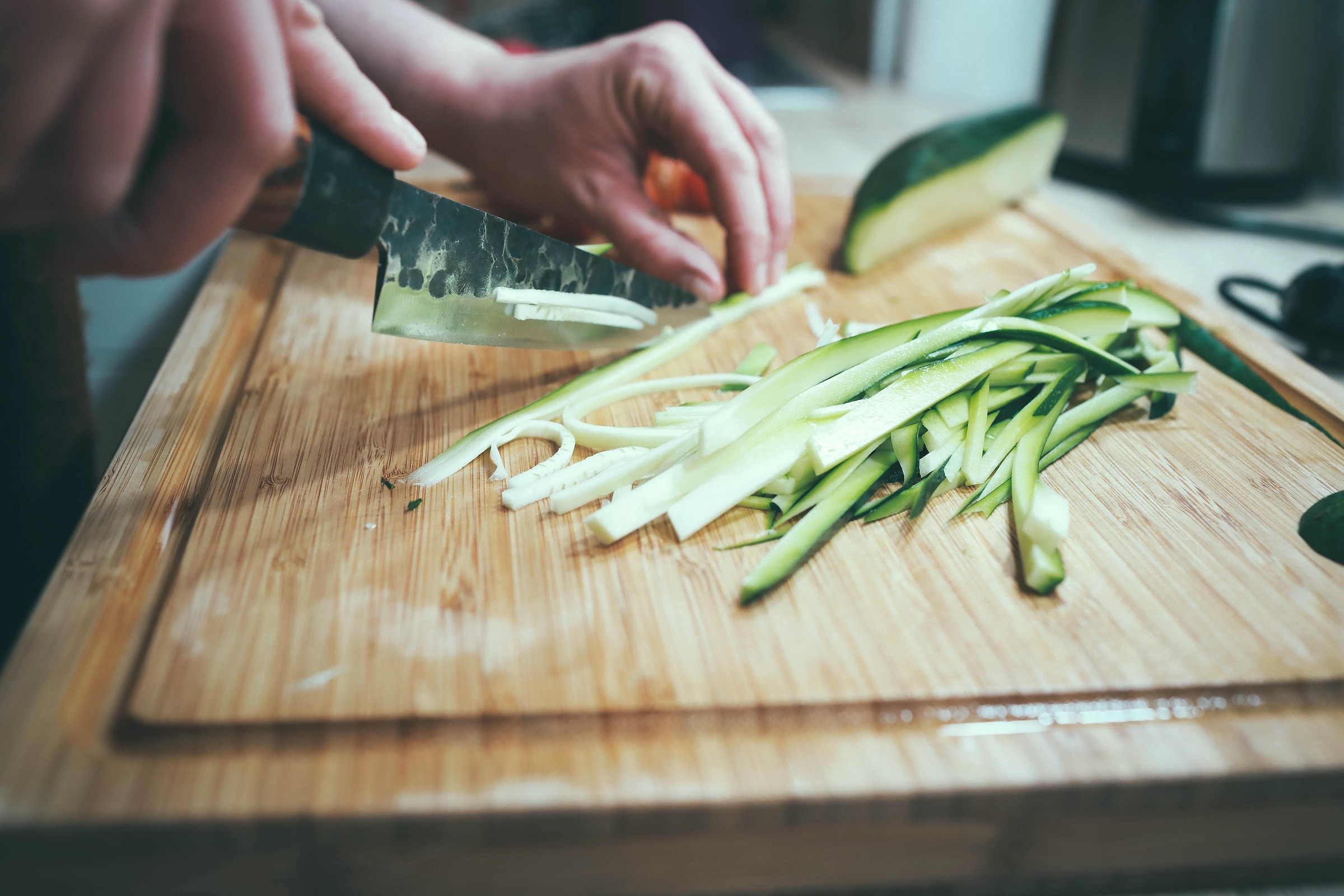 Person chopping vegetables | Source: Unsplash