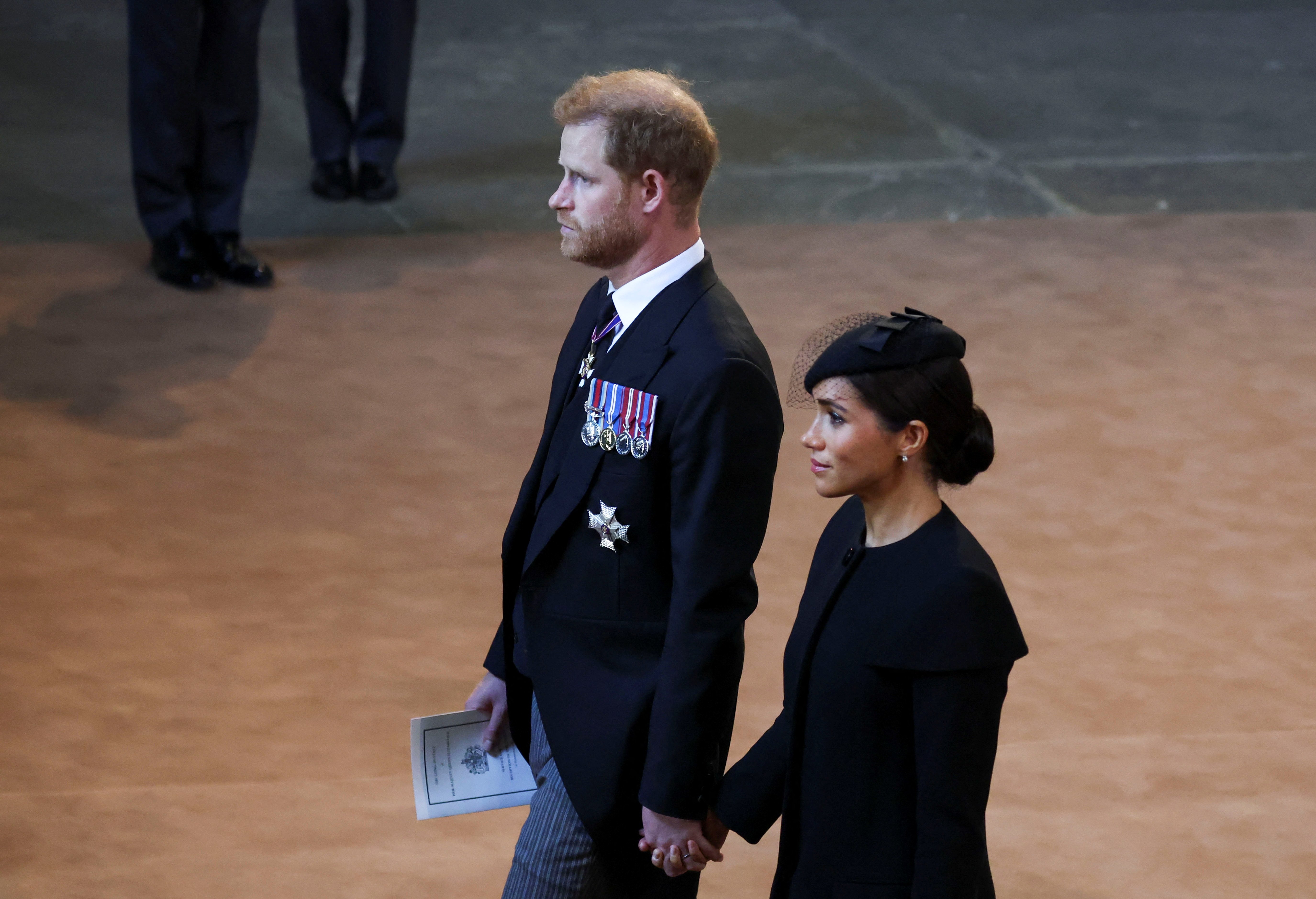 Prince Harry and Meghan Markle at the Queen precession in London 2022. | Source: Getty Images 
