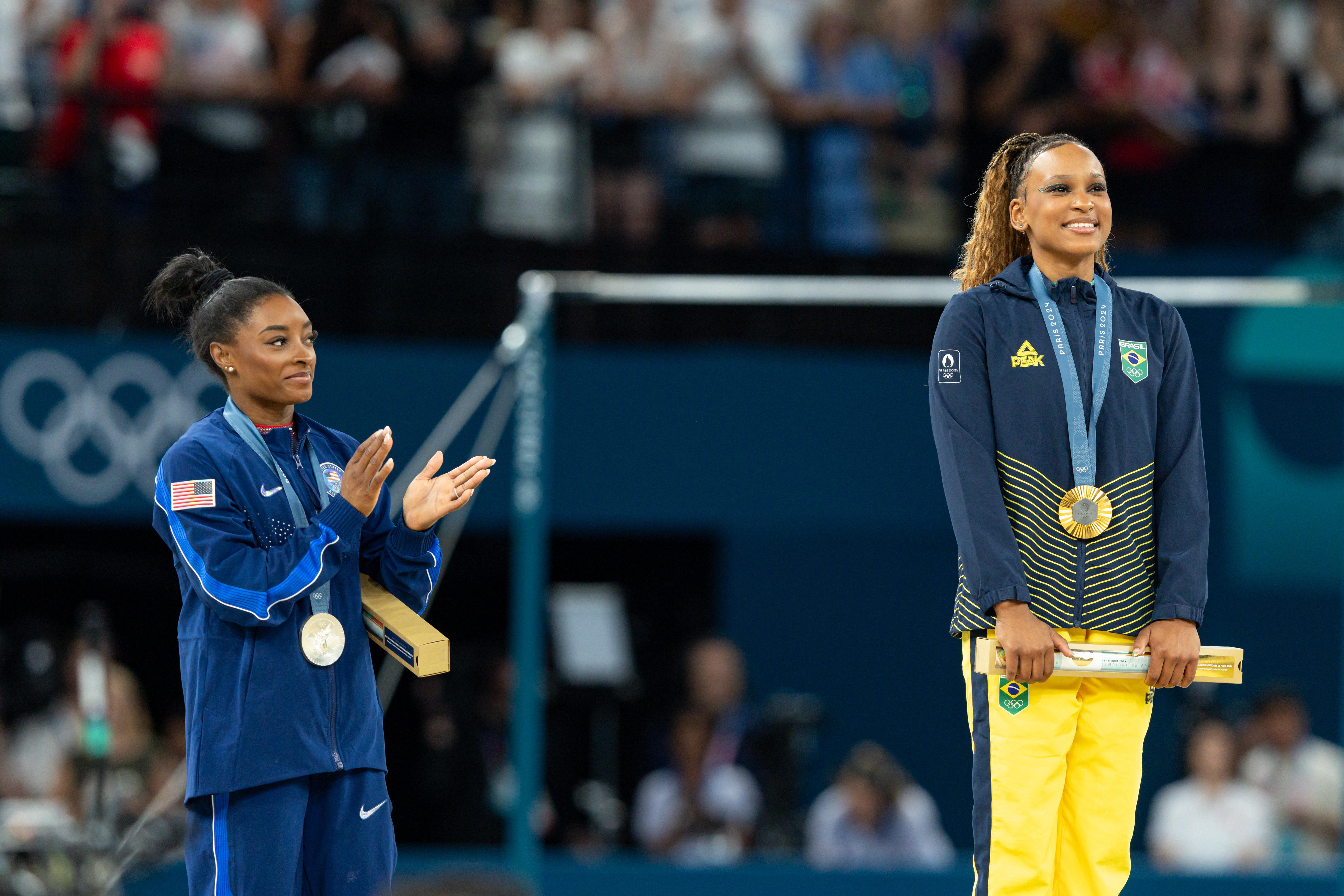 Simone Biles and Rebeca Andrade during the women's floor exercise final medal ceremony at the Paris Olympics in Paris, France on August 5, 2024 | Source: Getty Images