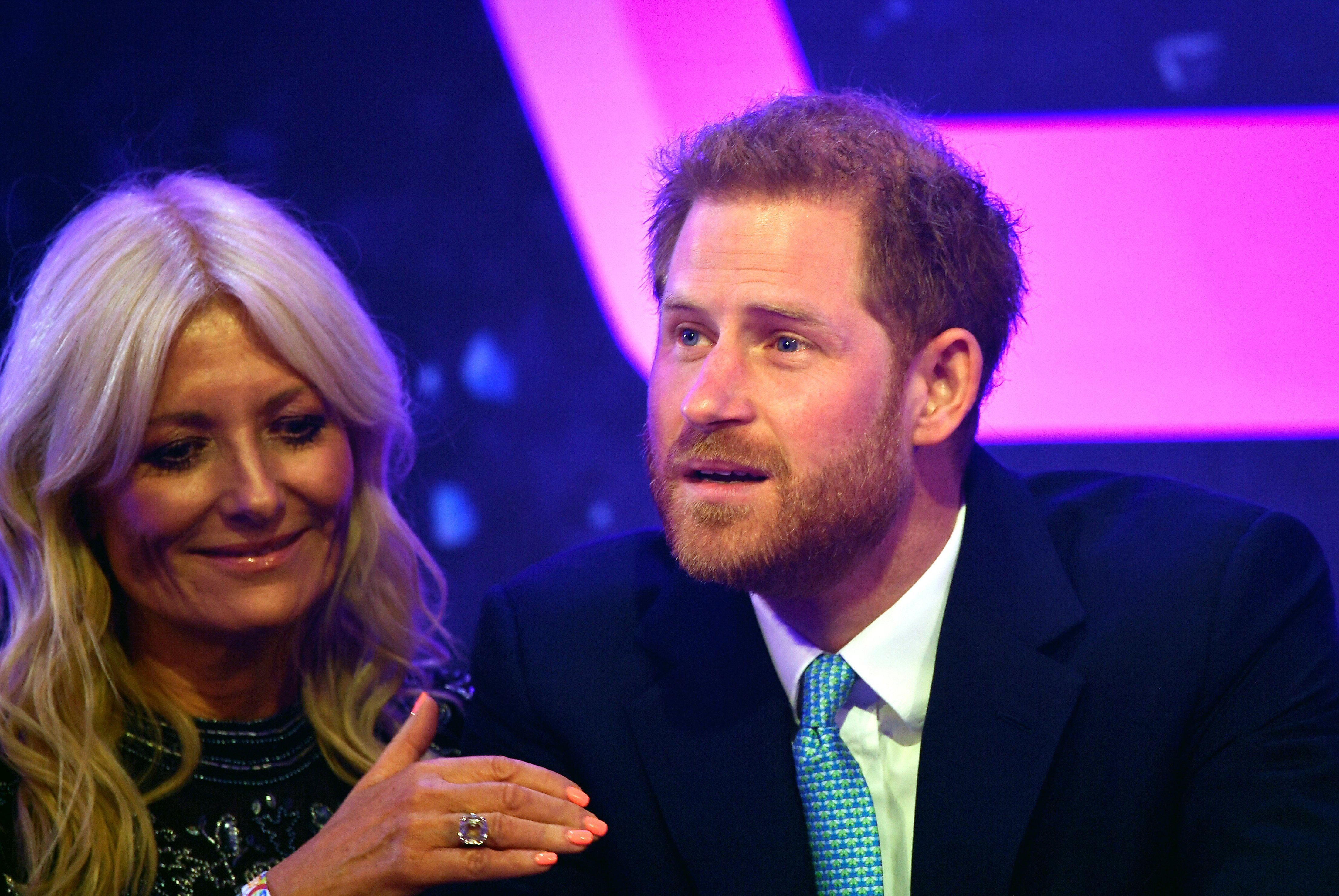 Prince Harry, Duke of Sussex reacts next to television presenter Gaby Roslin as he delivers a speech during the WellChild awards at Royal Lancaster Hotel on October 15, 2019 in London, England | Photo: Getty Images