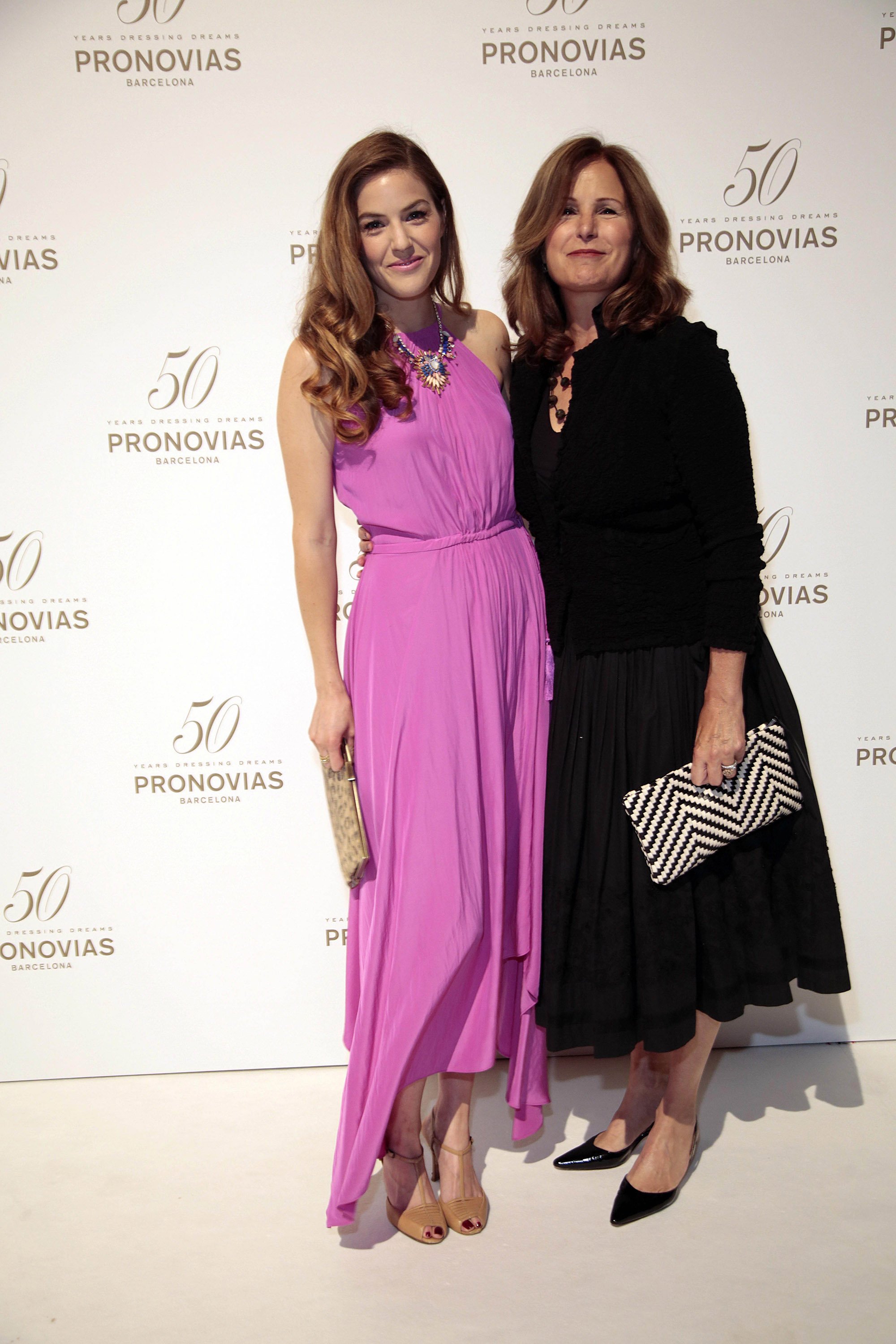  Lily Costner and Cindy Silva at a photocall for the Pronovia's 50th anniversary bridal fashion show during 'Barcelona Bridal Week'on May 9, 2014, in Barcelona, Spain. | Source: Getty Images