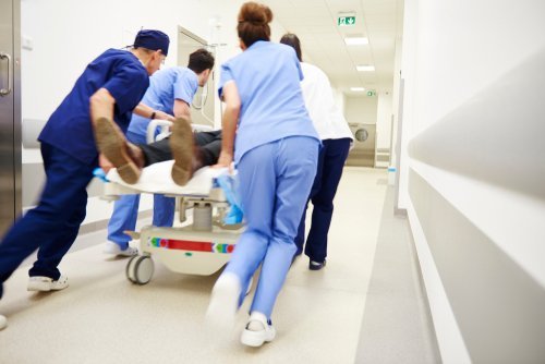 Doctors rushing a patient to an operating room. | Source: Shutterstock.