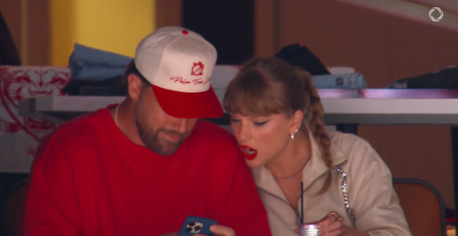 Travis Kelce and Taylor Swift looking at his phone during Game Four of the 2025 Stanley Cup Final at Amerant Bank Arena on June 12, 2025, in Sunrise, Florida | Source: X/Sportsnet
