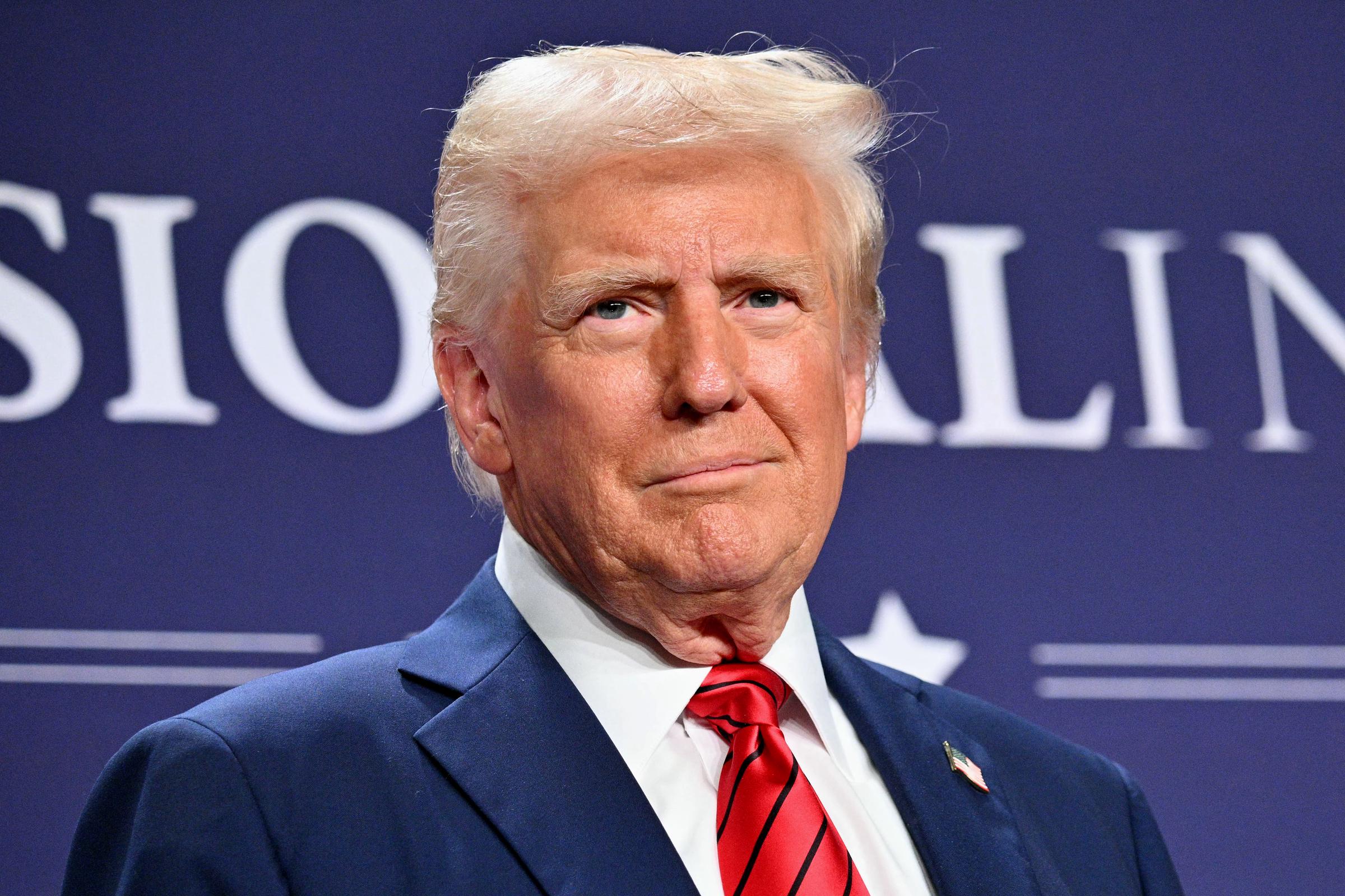 US President Donald Trump looks on after delivering remarks at the House Republican Members Conference Dinner at Trump National Doral in Miami, Florida, on January 27, 2025. | Source: Getty Images