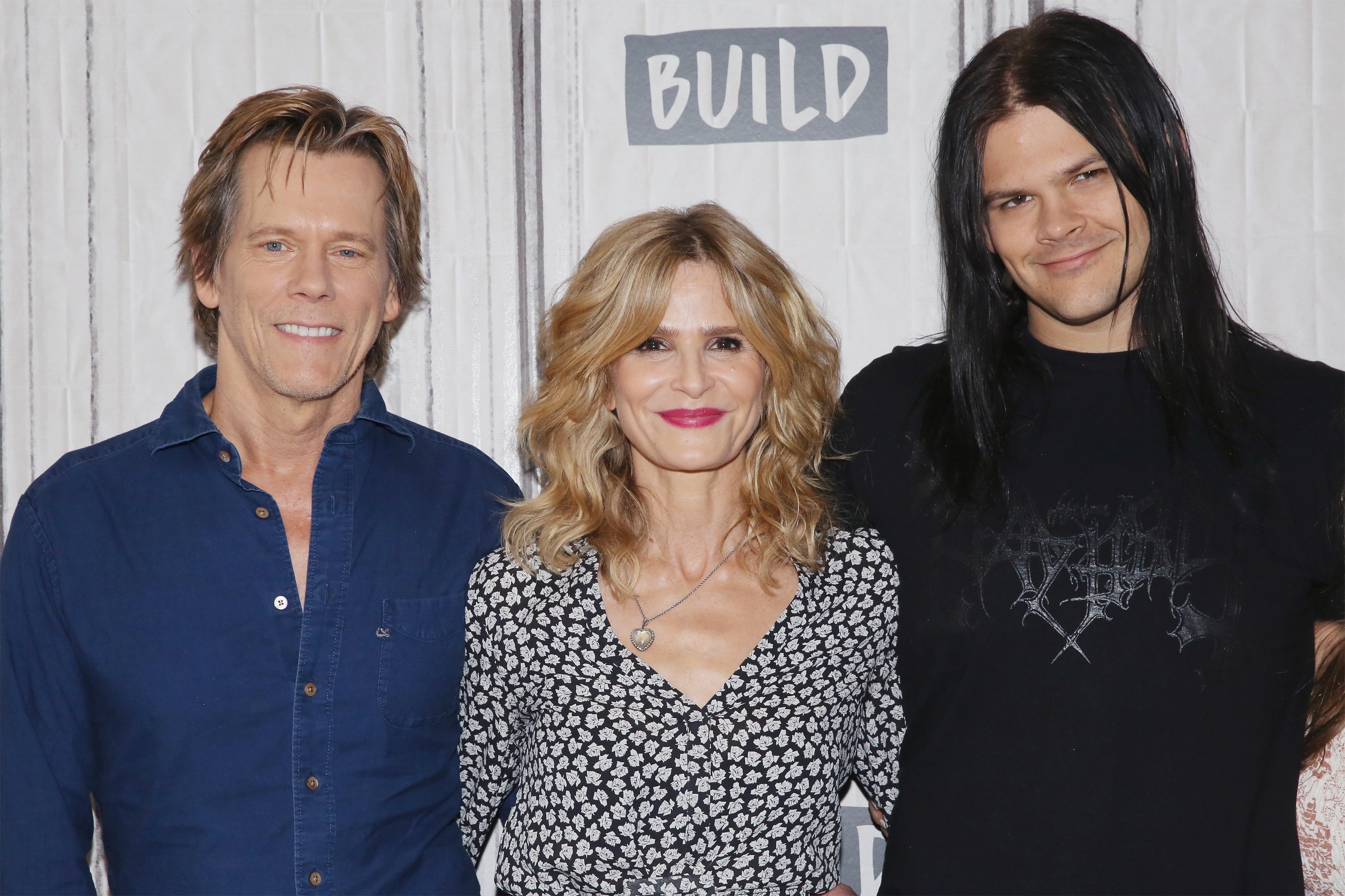 Kevin Bacon, Kyra Sedgwick, and Travis Bacon visit Build to discuss the Lifetime film "Story of a Girl" at Build Studio on July 21, 2017 in New York City. ┃Source: Getty Images