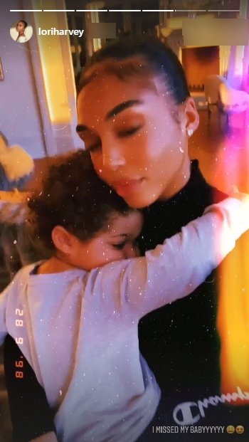 Lori Harvey and her baby nephew Ezra sharing an embrace  | Photo: Instagram/loriharvey
