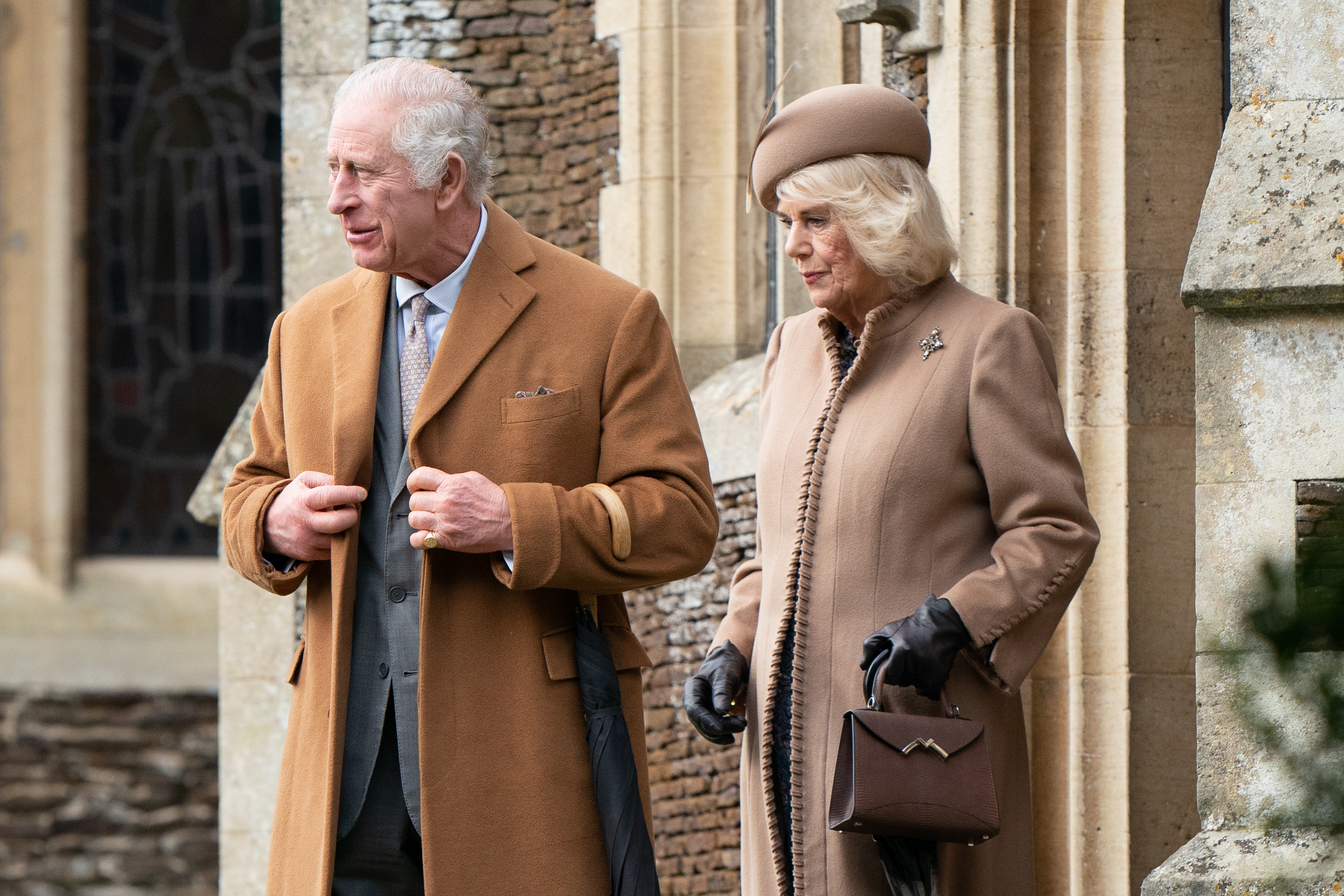 King Charles III and Queen Camilla leave after the Christmas Morning Service at Sandringham Church in Sandringham, Norfolk, on December 25, 2023. | Source: Getty Images
