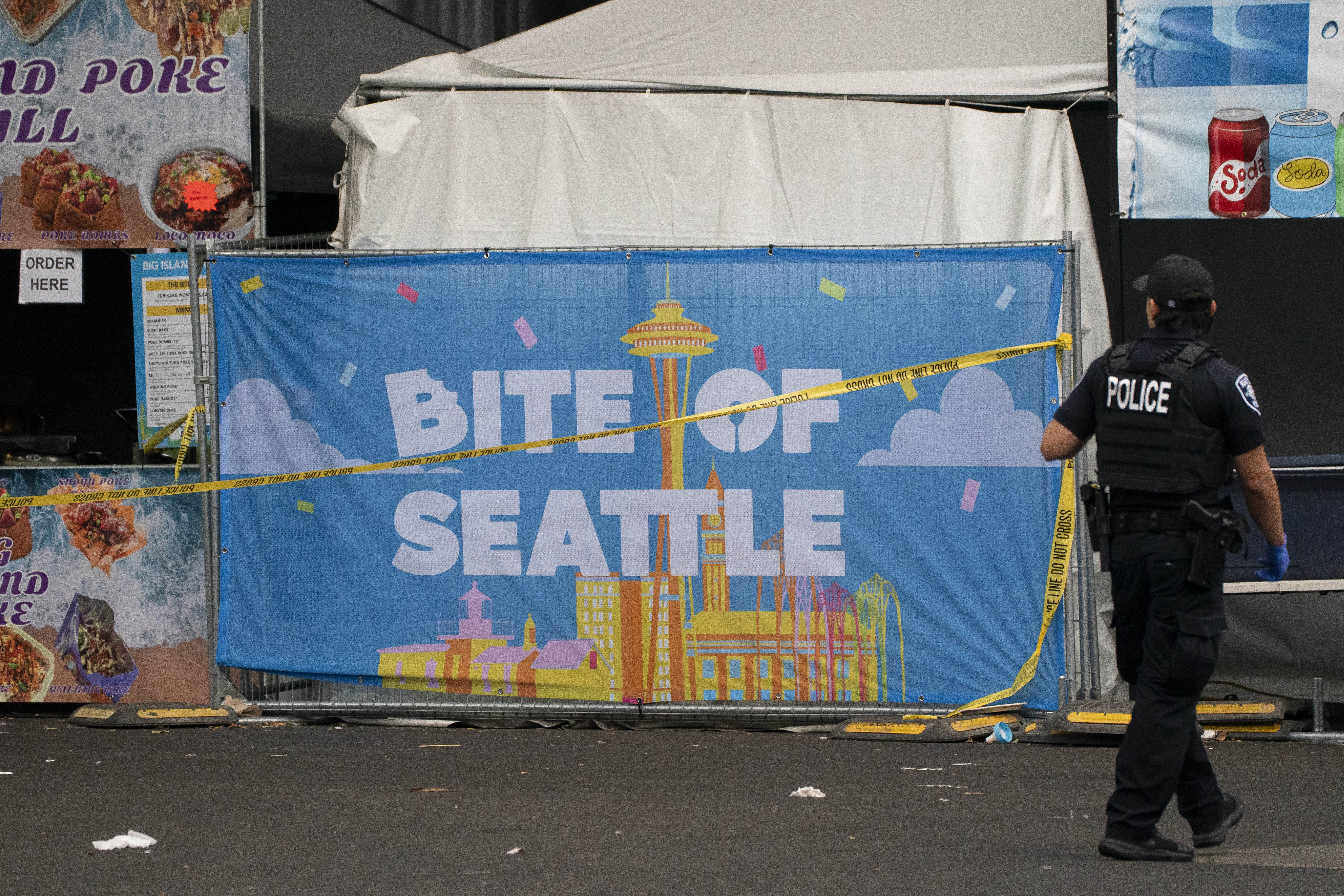 A police officer patrols near the Bite of Seattle festival grounds after the area was cordoned off following the shooting. | Source: Getty Images