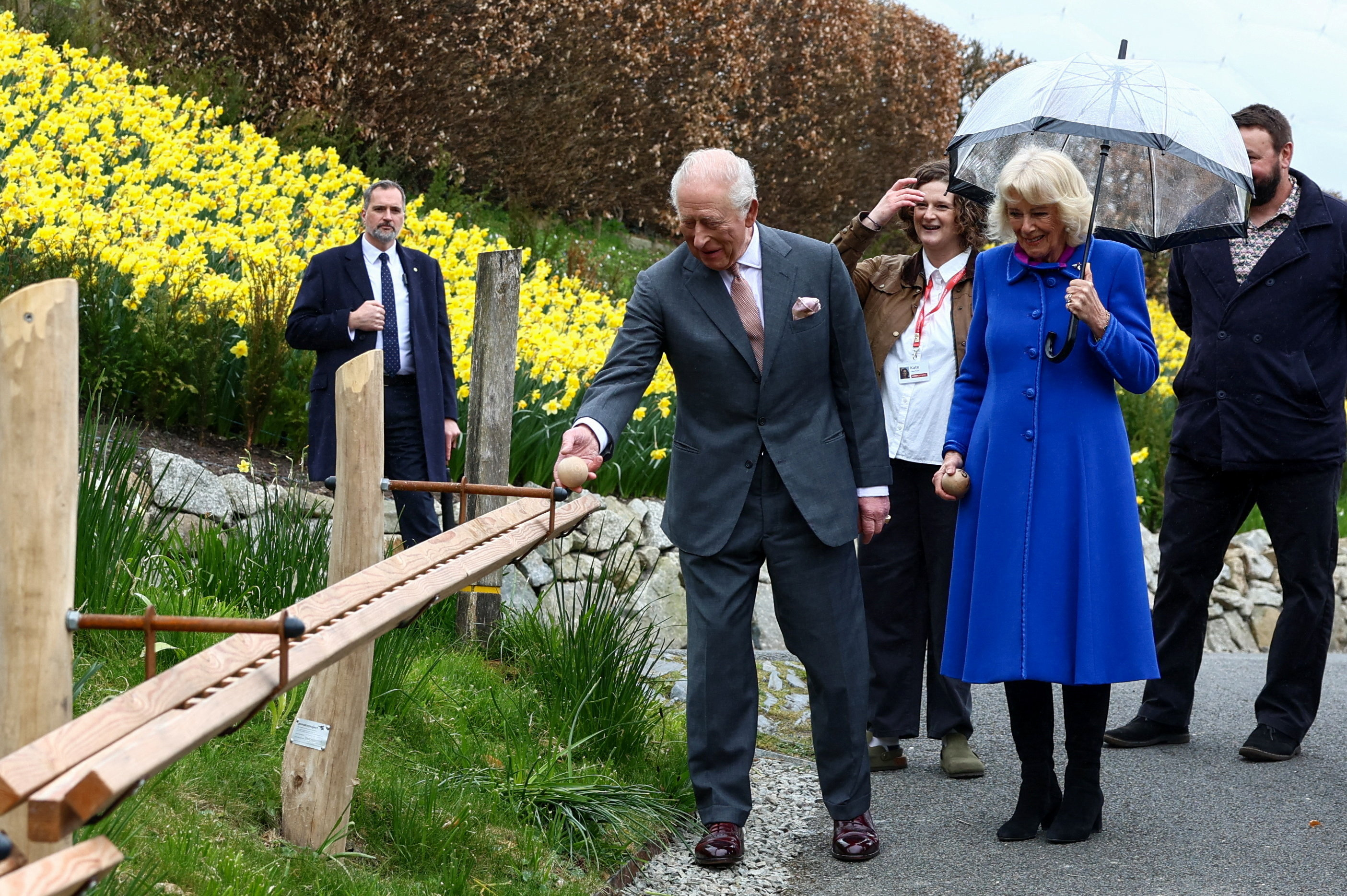King Charles III and Queen Camilla view a section of a new marble run created for visitors from over 100 metres of handcrafted wooden track at The Eden Project during an event to mark its 25th anniversary on 24 March 2026 in St Austell, England. | Source: Getty Images