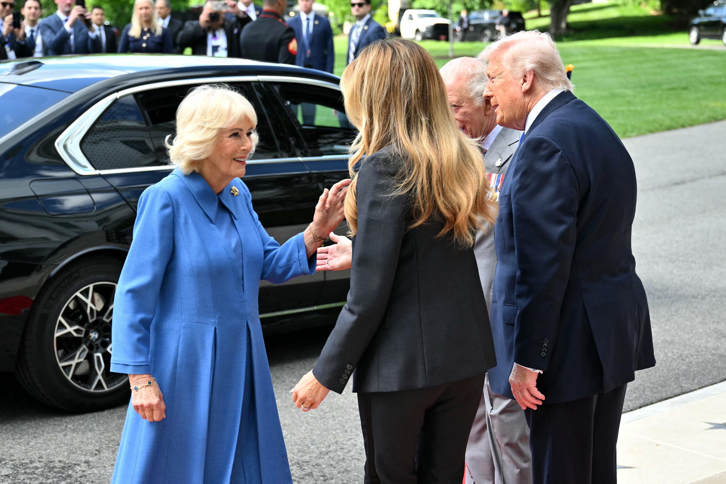 Donald Trump and Melania Trump greet King Charles III and Queen Camilla during a formal farewell on the White House South Lawn, in Washington, DC, on April 30, 2026. | Source: Getty Images