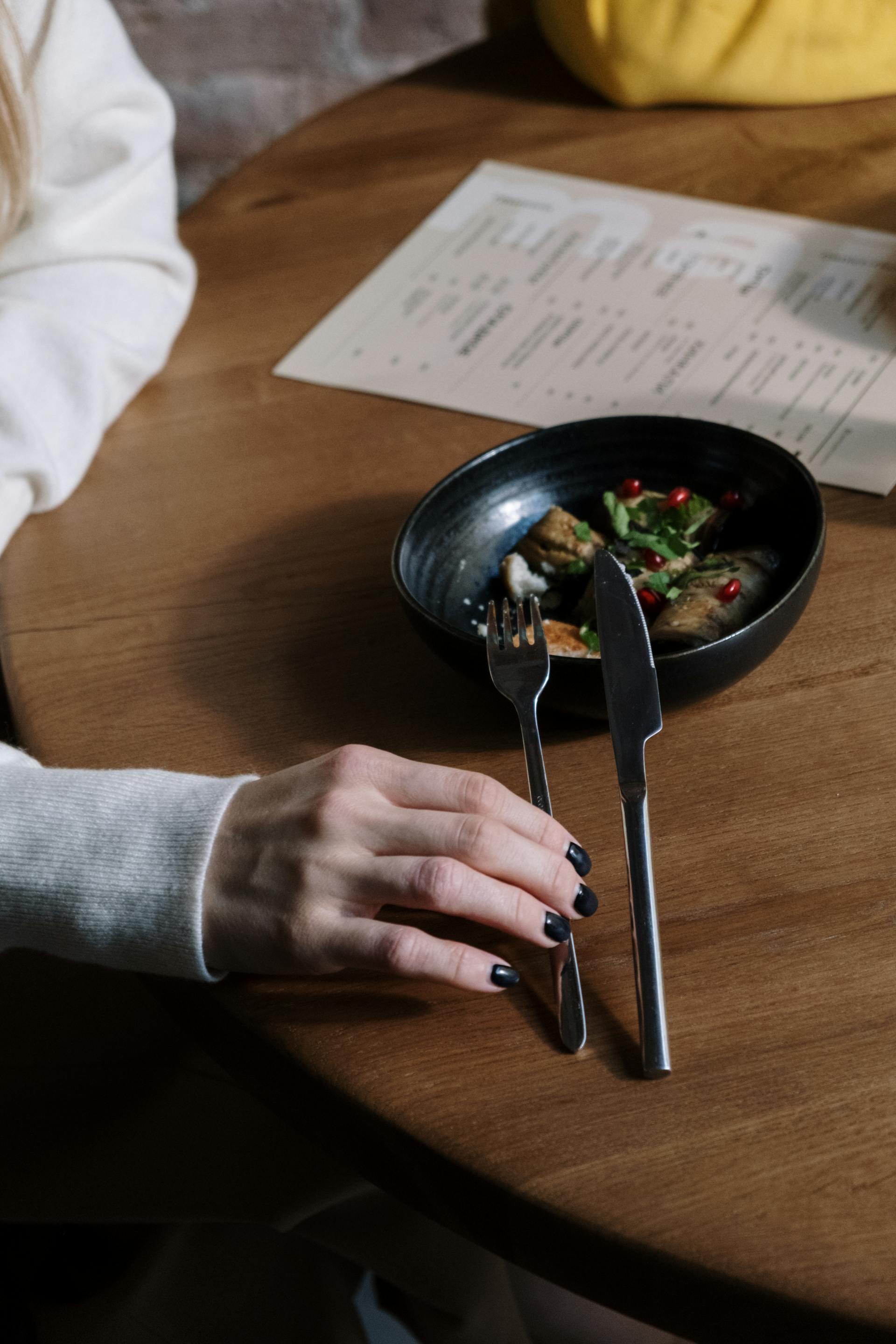 A woman holding a fork | Source: Pexels