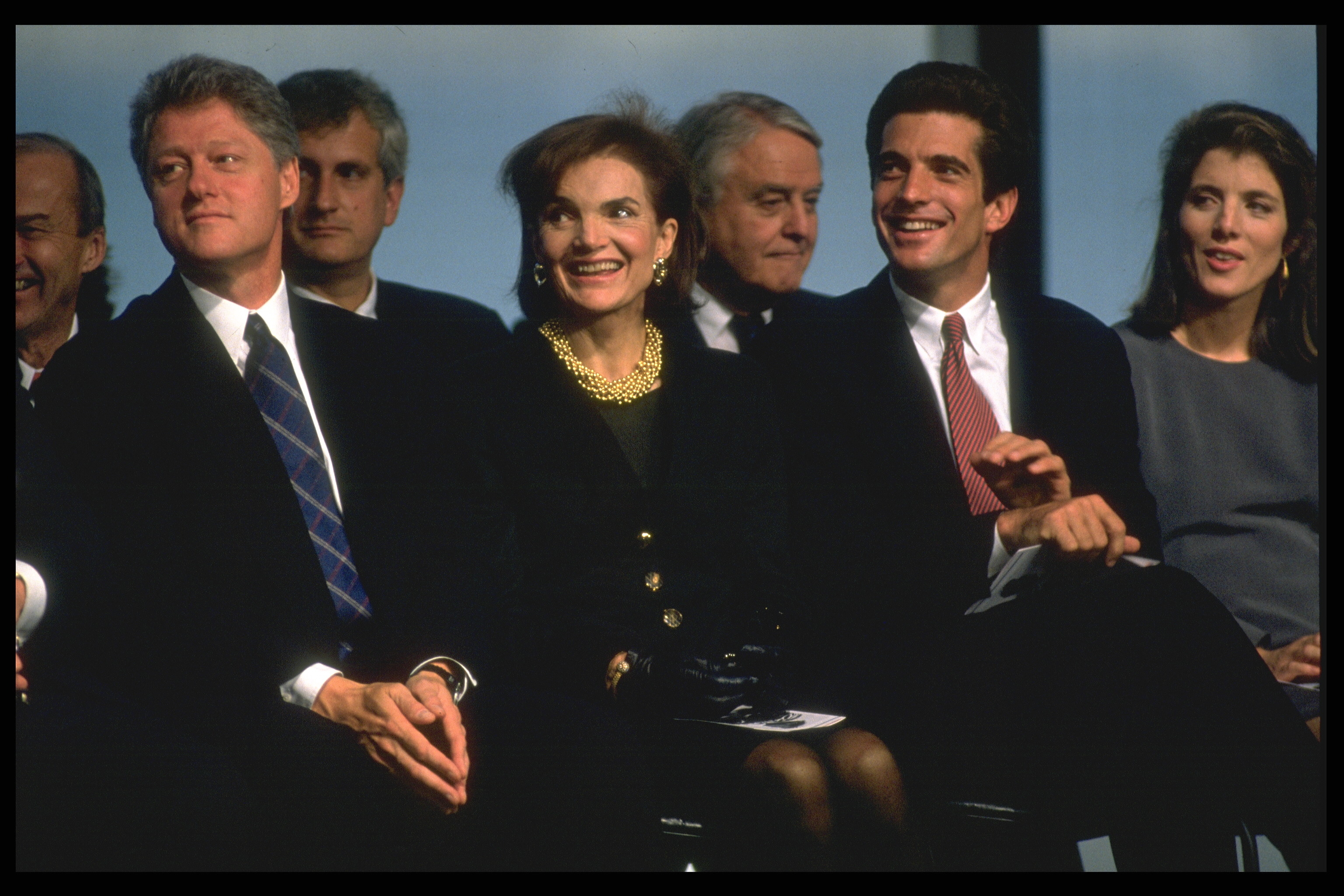 Bill Clinton, Jackie Onassis, John-John Kennedy, and Caroline Kennedy at the opening of the renovated John F. Kennedy Library in 1993 | Source: Getty Images