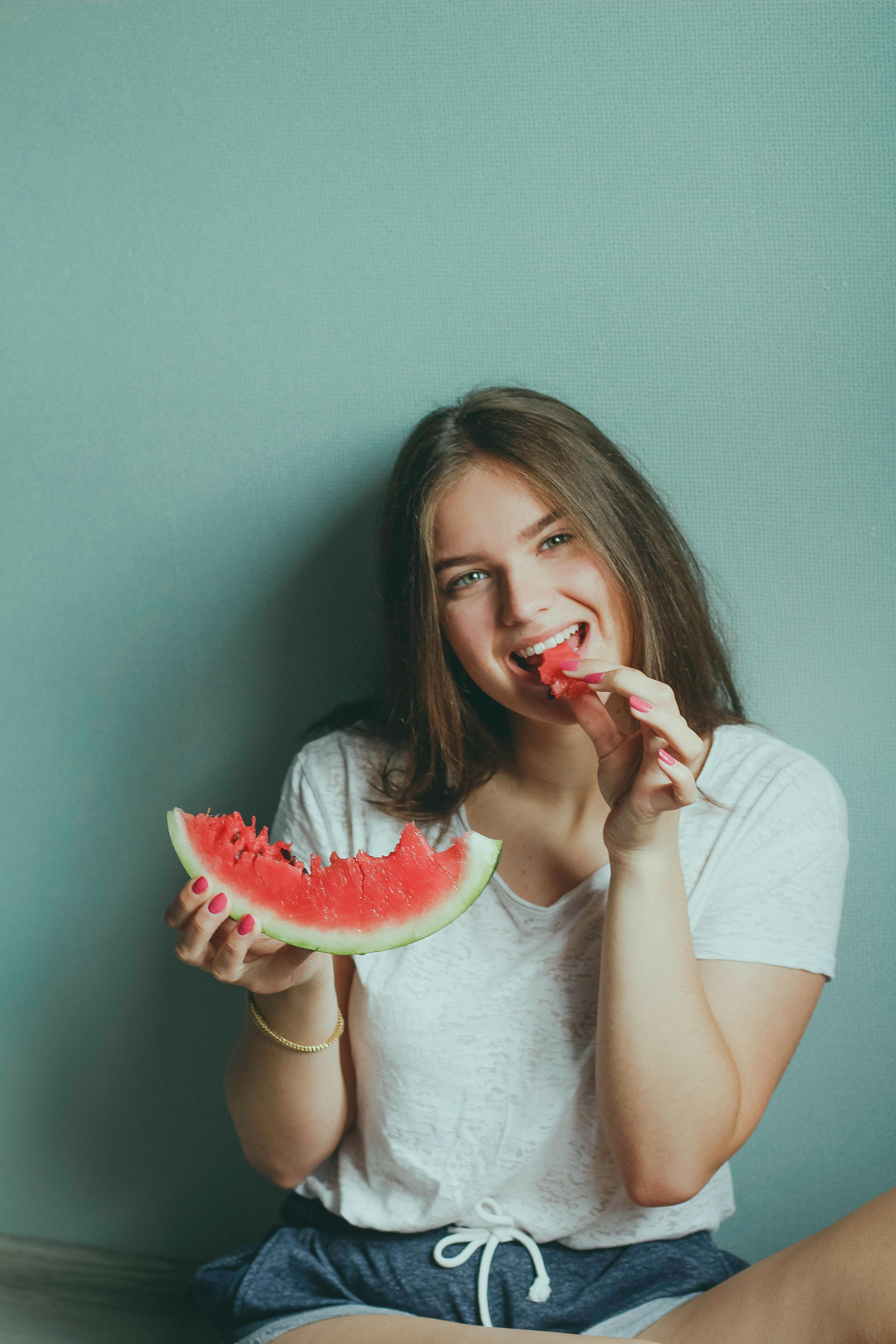 A girl eating watermelon | Source: Pexels