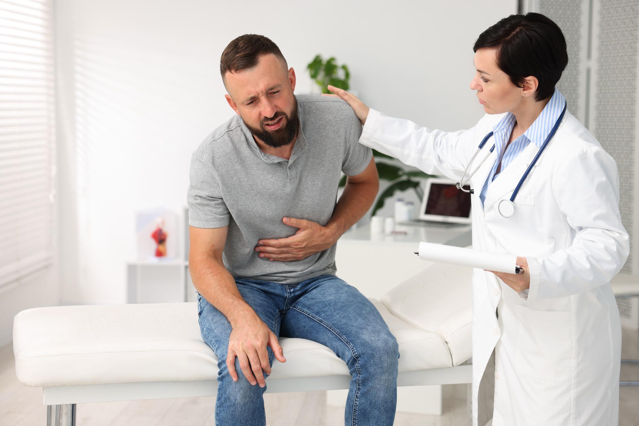 A person experiences abdominal discomfort in an illustrative image. Salmonella infection can cause symptoms including diarrhea, fever, stomach cramps, nausea, and vomiting after consuming contaminated food. | Source: ChatGPT