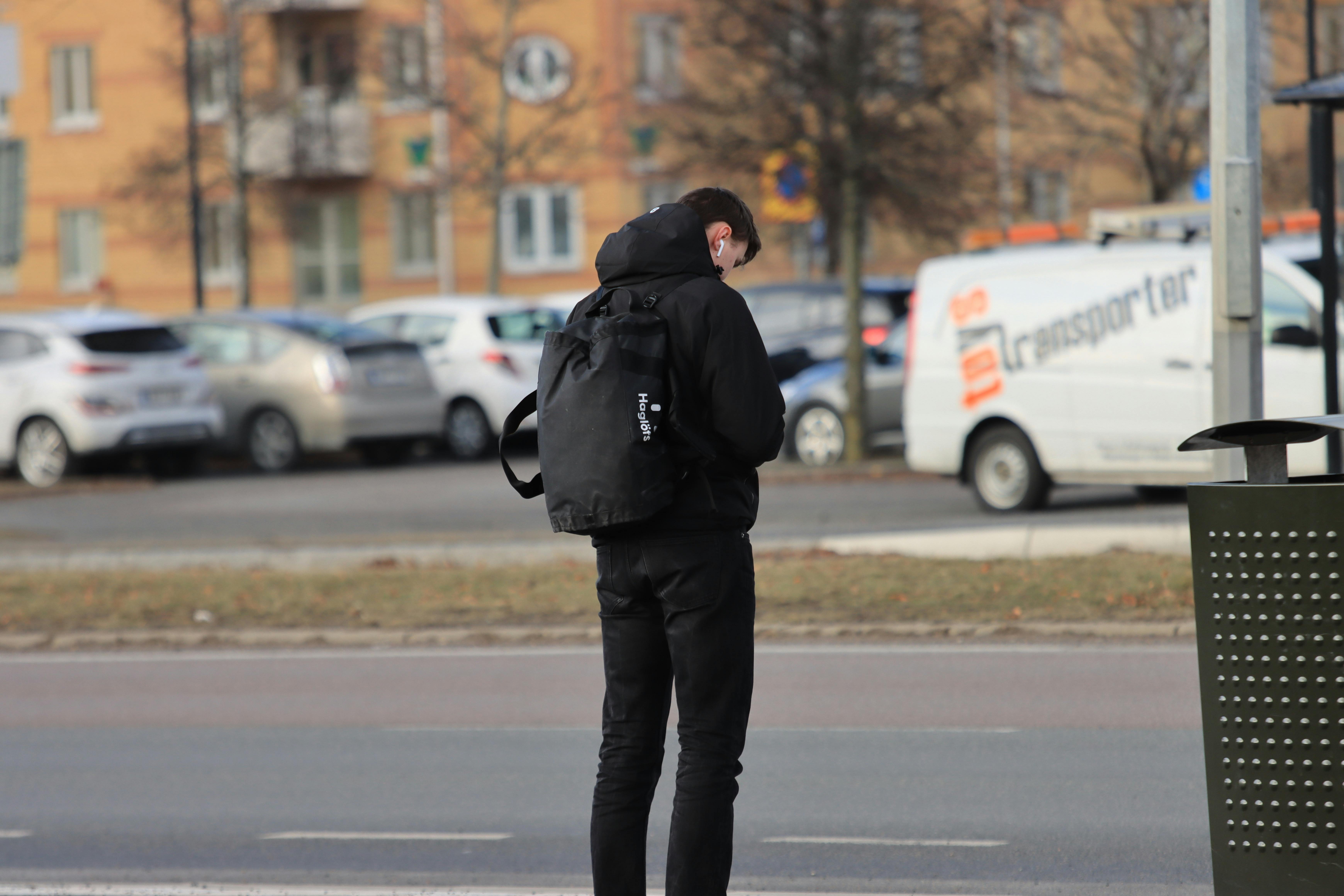 Man on a bus stop | Source: Pexels