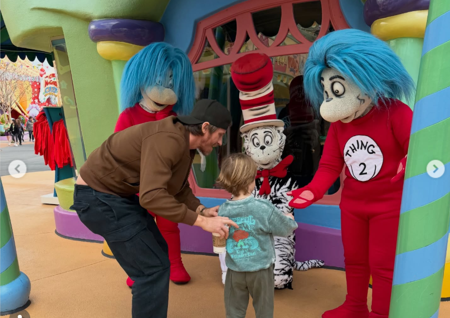Rhodes Roberts Hedlund and his father Garrett are captured as Garrett guides his son towards the costumed characters, from a post dated January 16, 2026. | Source: Instagram/emmaroberts