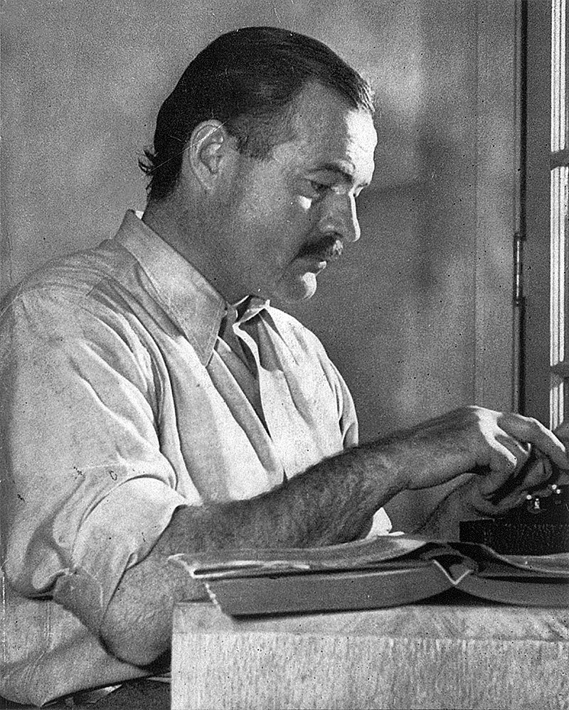 Ernest Hemingway working on his book "For Whom the Bell Tolls" in Idaho, in 1939 | Source: Wikimedia Commons/Lloyd Arnold, Ernest Hemingway, marked as public domain